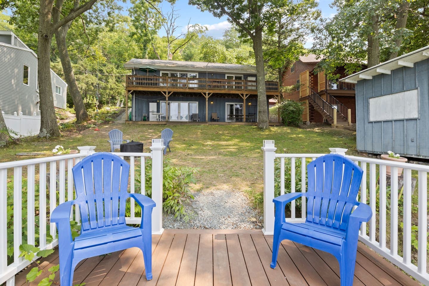 Deck with colorful Adirondack chairs