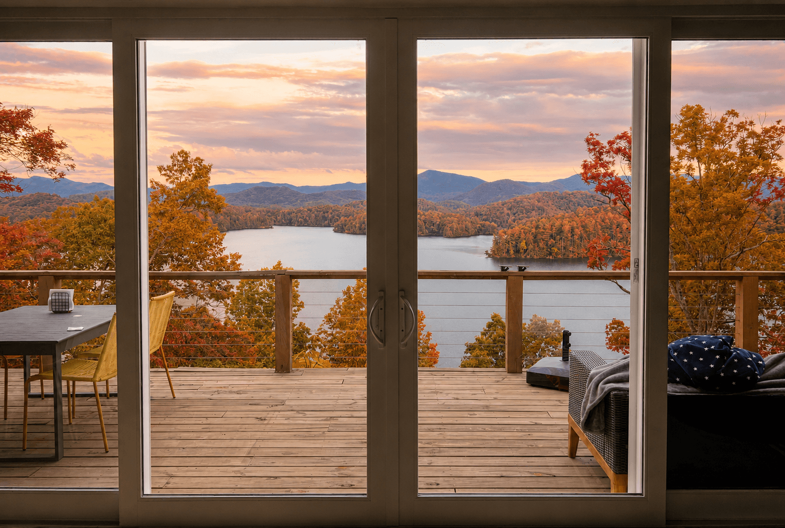 The best seat in the house. ☕🏔️ Wake up to sweeping views of Lake Santeetlah and the Smoky Mountains from the comfort of Hidden Point House.