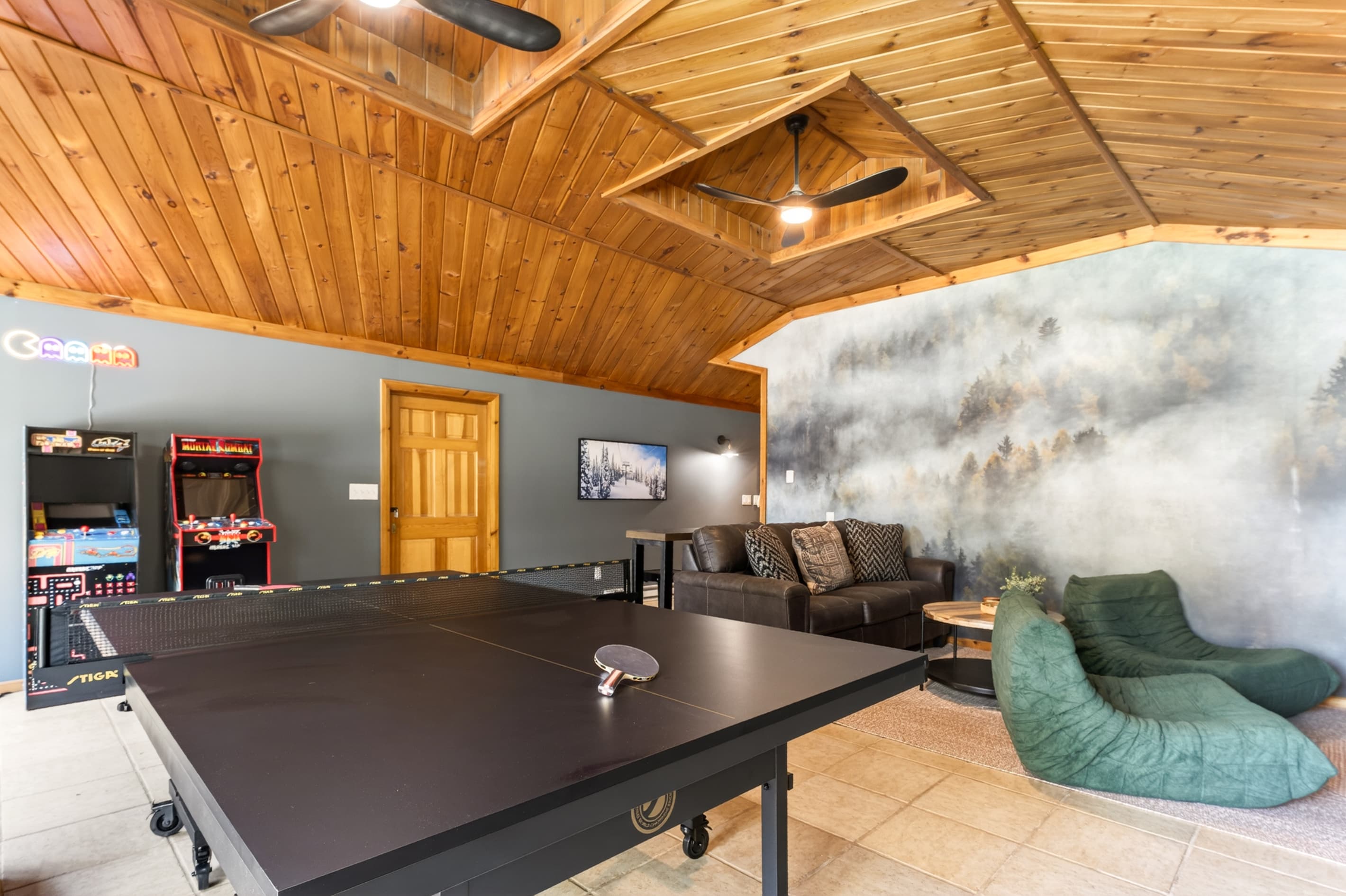Game room with ping pong table and sectional