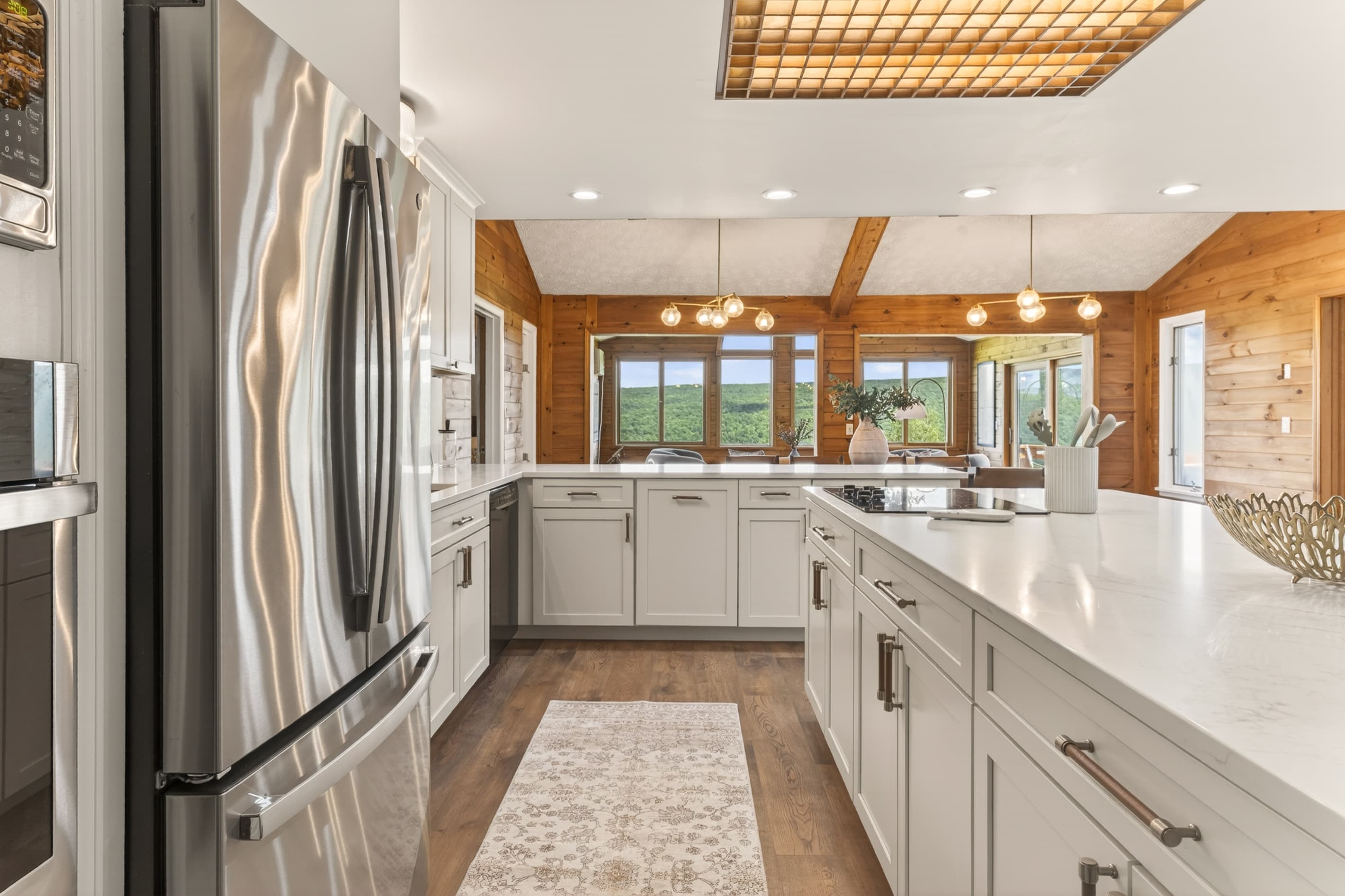 Galley kitchen with white cabinetry
