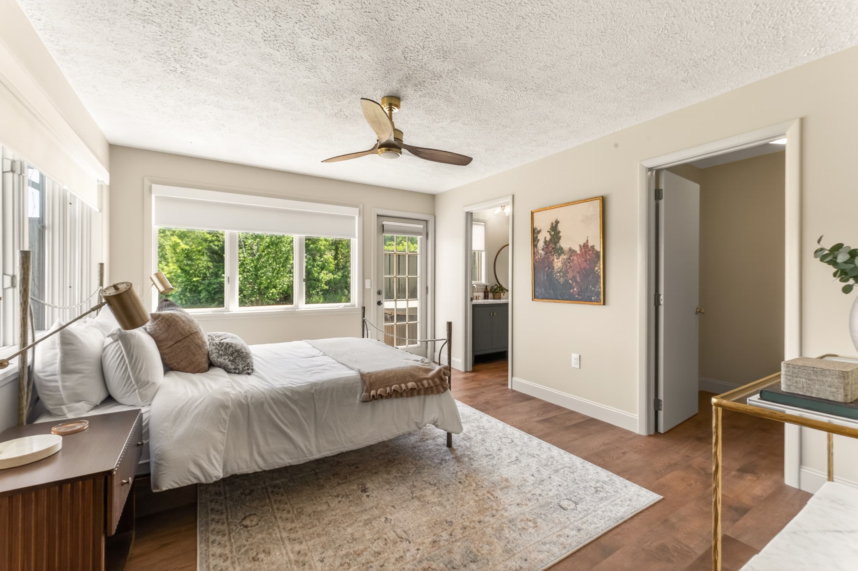 Bedroom with multiple beds and ceiling fan