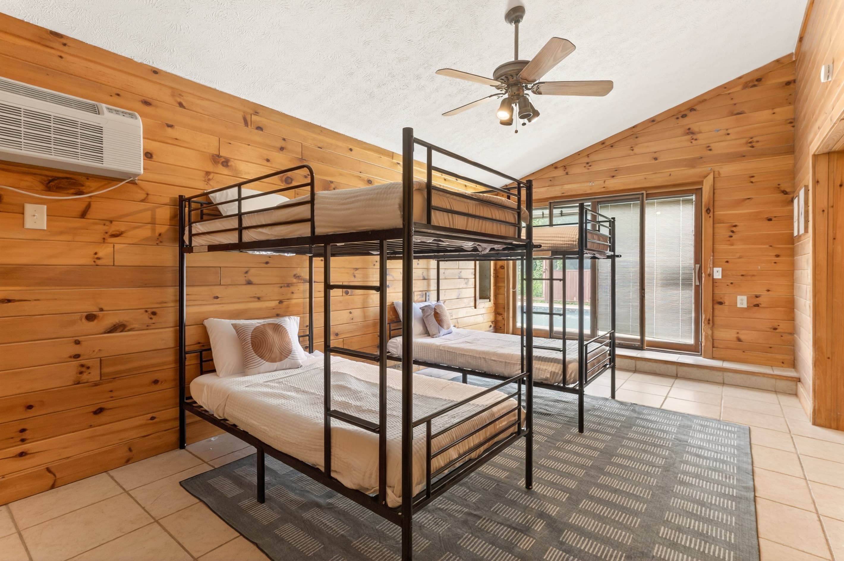 Bunk room with two metal-framed beds
