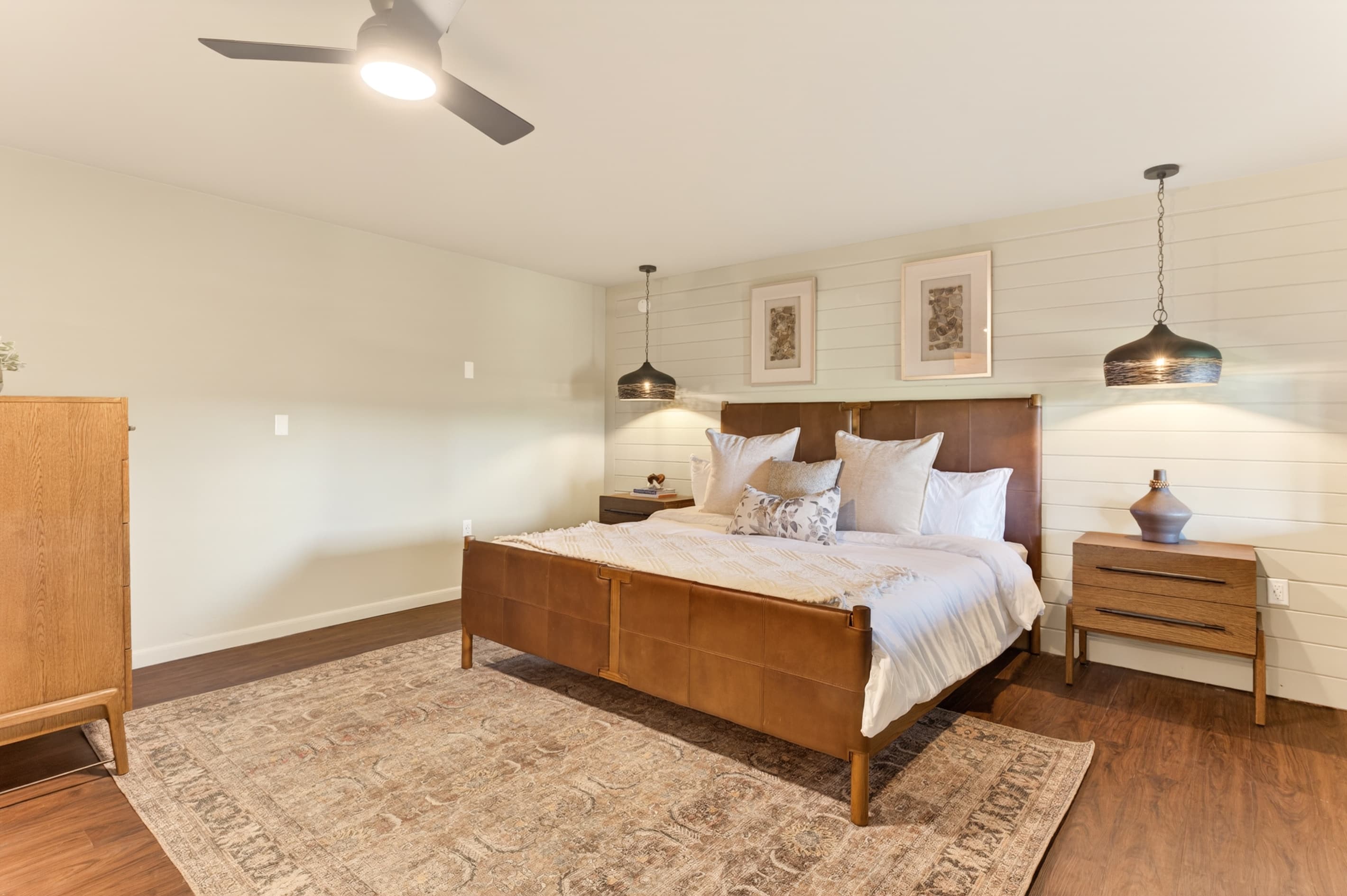 Bedroom with wood bed and ceiling fan