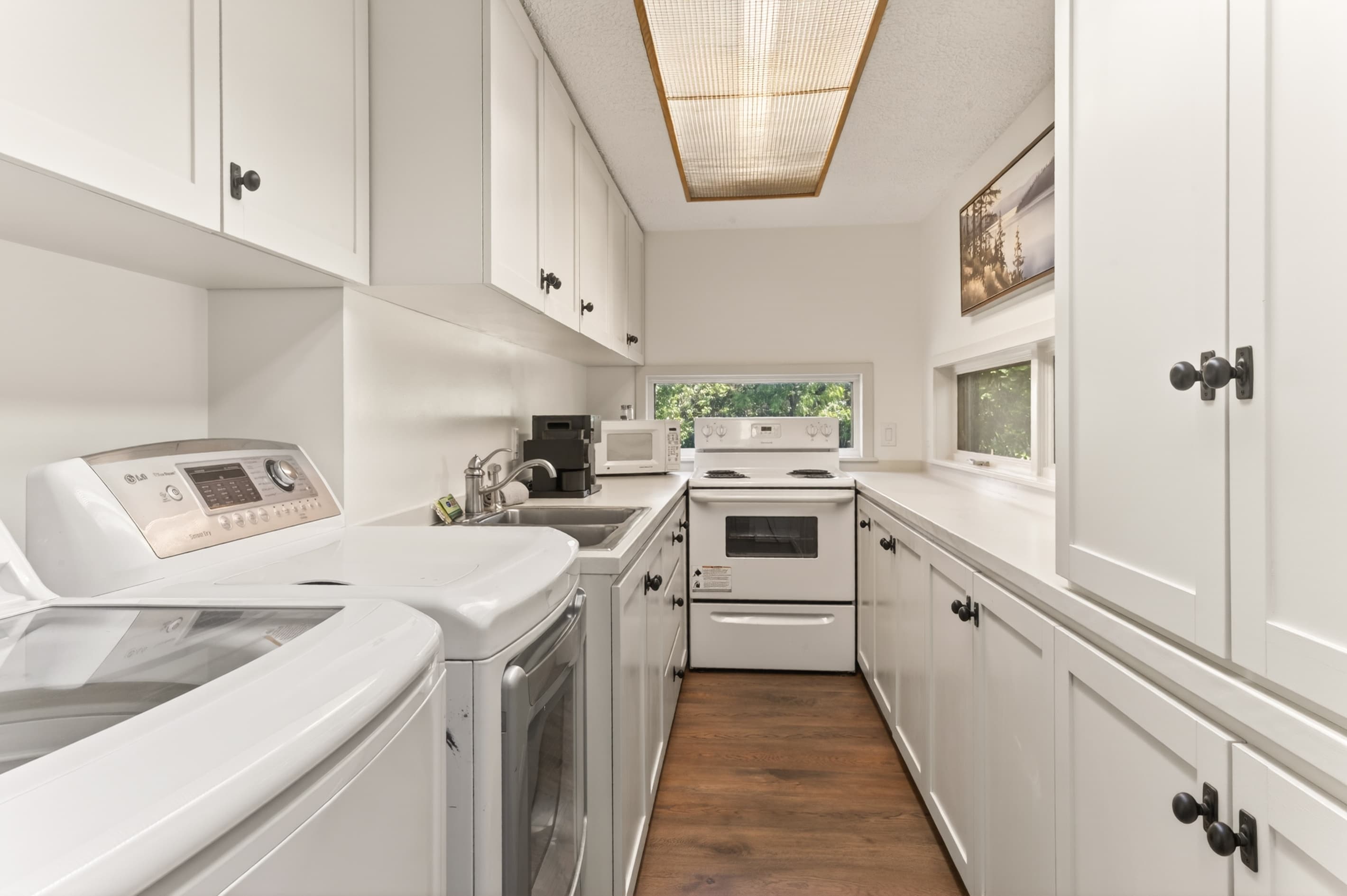 White bathroom with vanity and glass shower