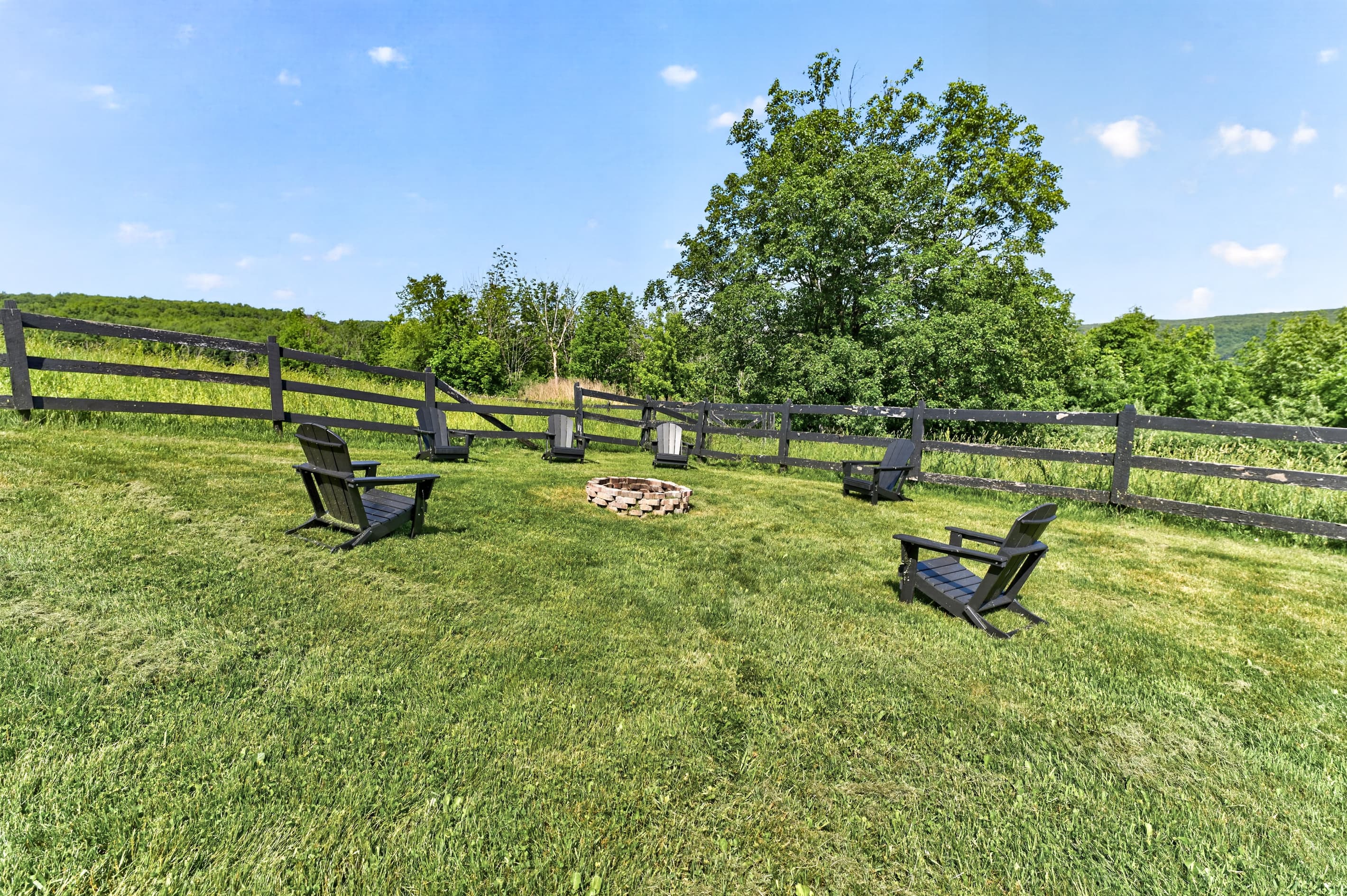Lawn seating beside the wooden fence