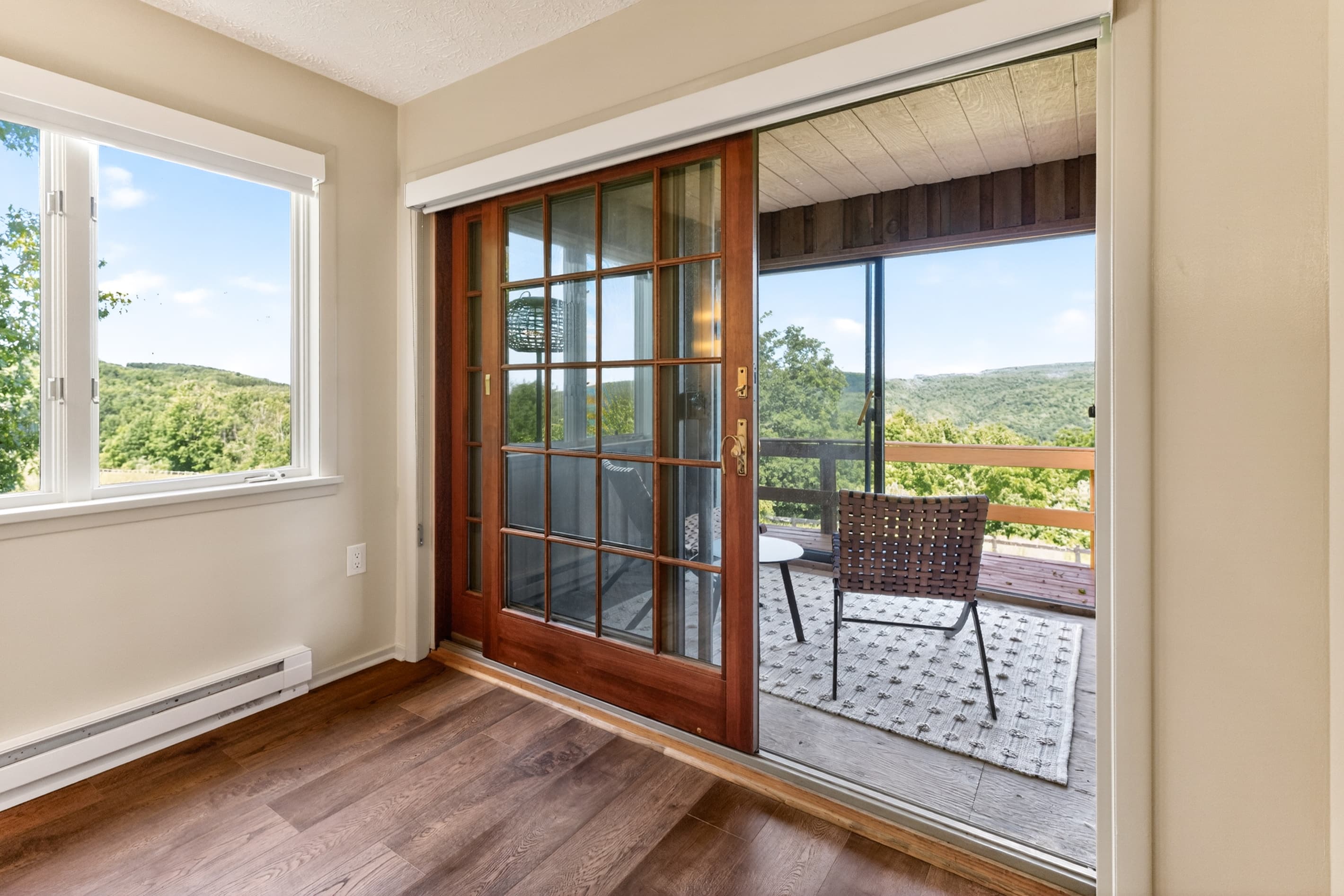 Glass doors opening to the outdoor balcony