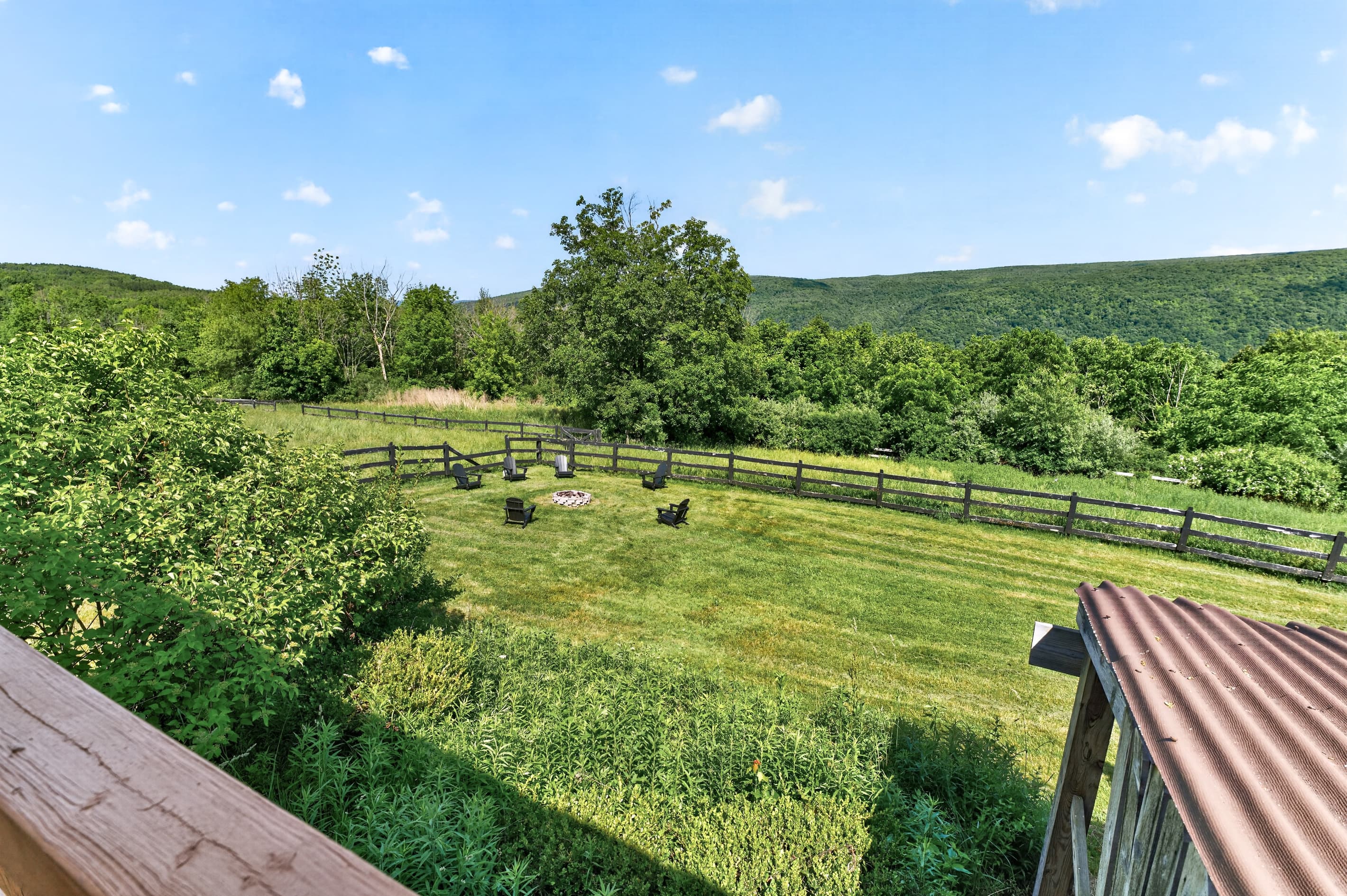View across the fenced grassy field