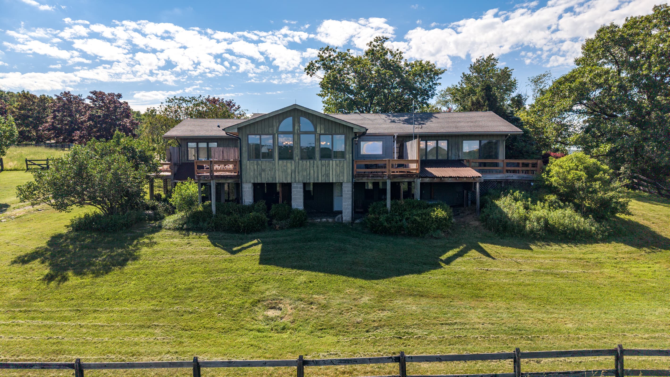 Home viewed across the grassy field