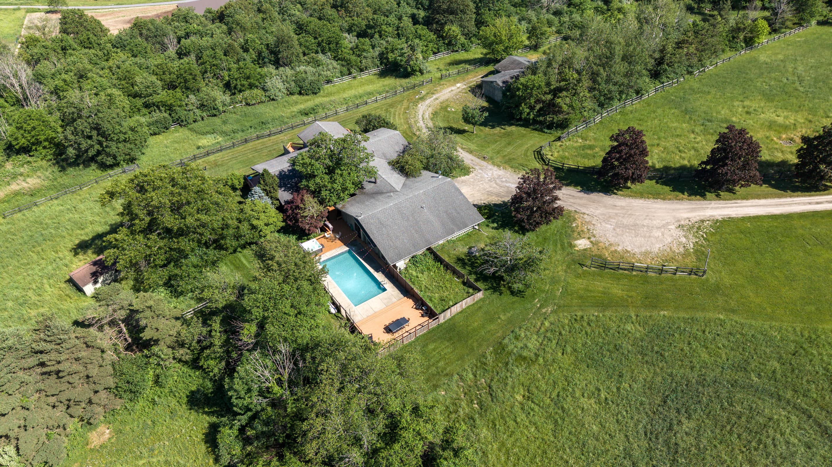 Aerial view of the home and pool