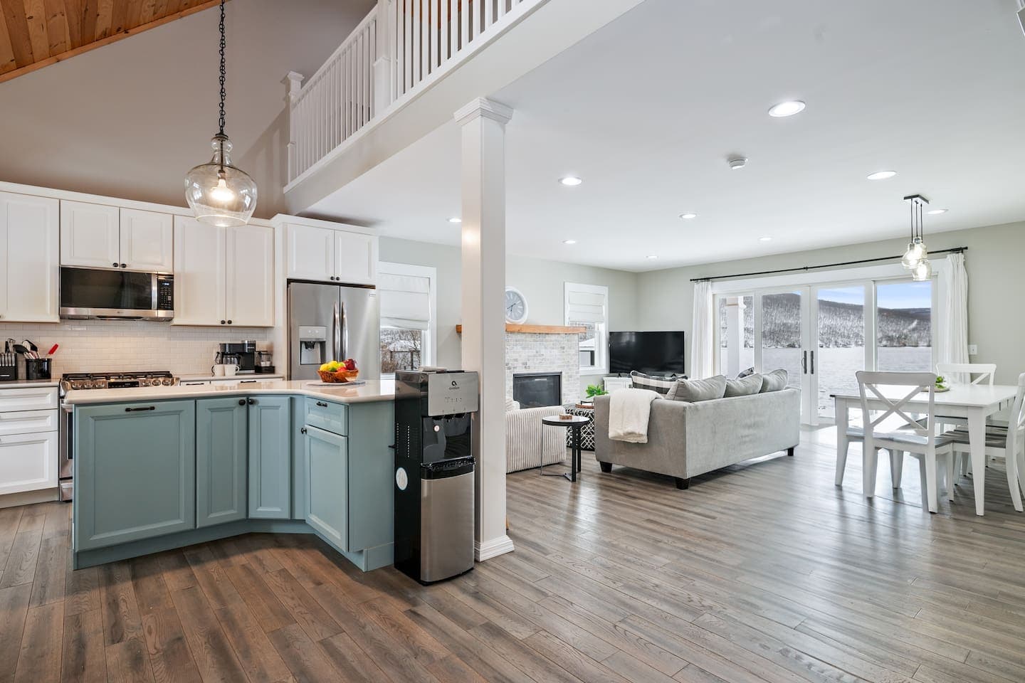 Open living space with staircase and kitchen