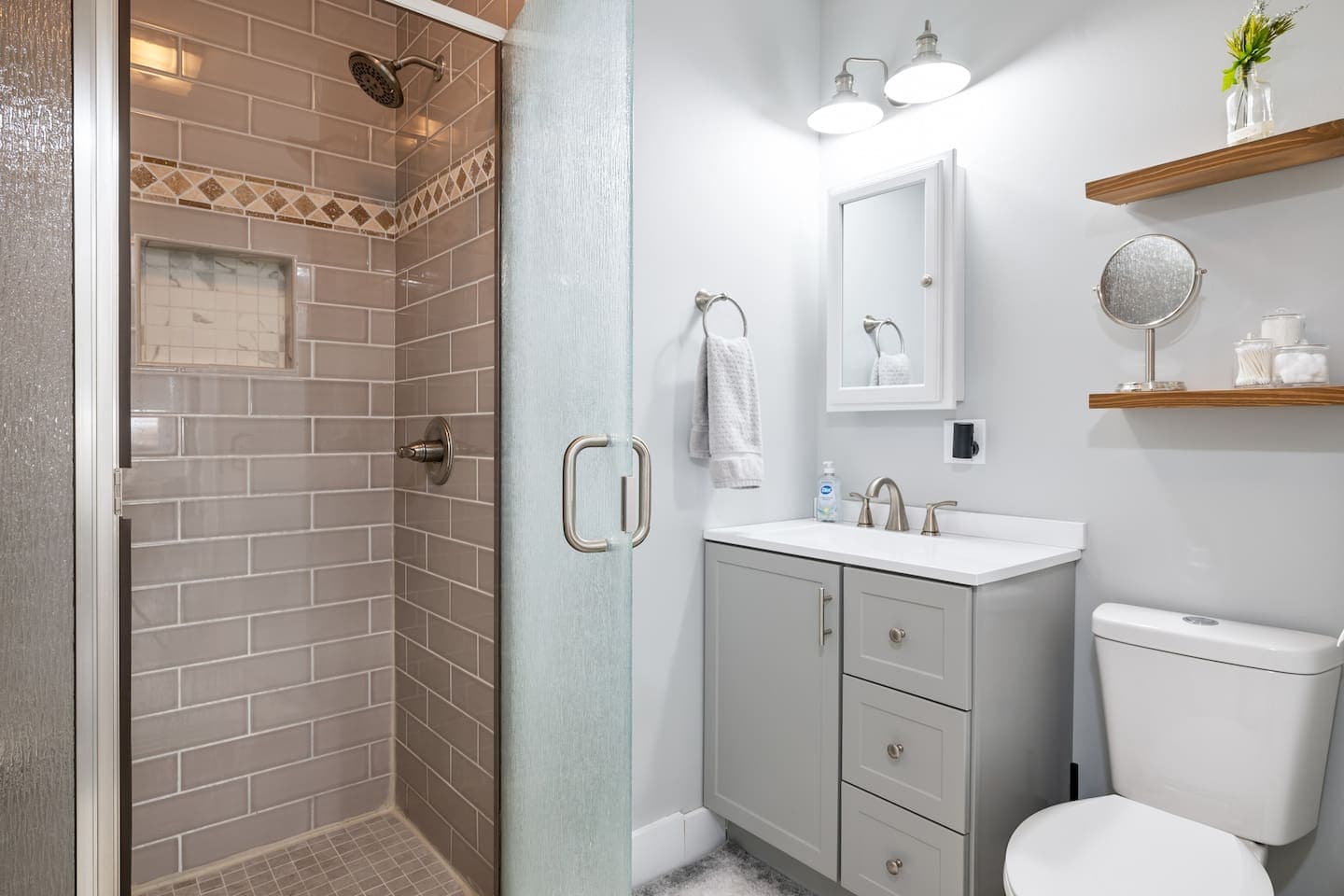 Full bathroom with glass-enclosed shower
