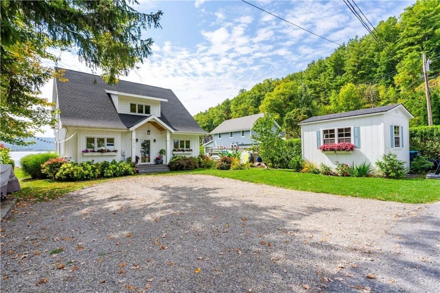 Side exterior beside the gravel driveway