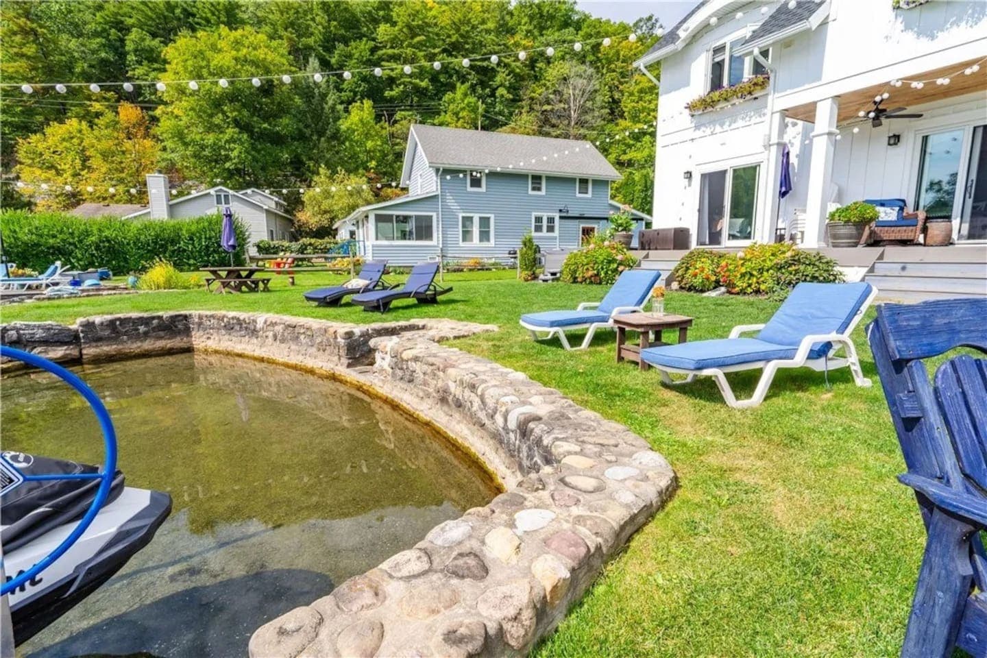 Waterfront access with steps and lounge chairs