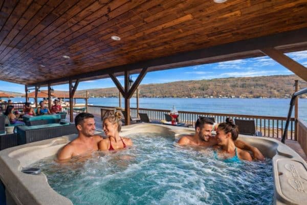 Covered hot tub overlooking the lake
