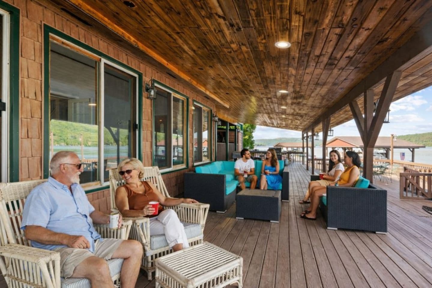 Covered deck with lakeside lounge and seating area