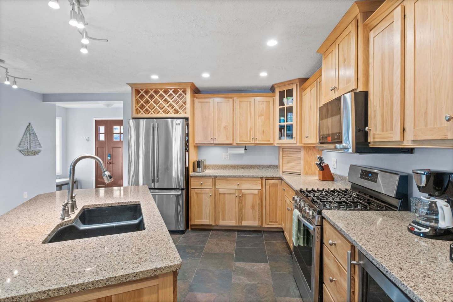 Kitchen with wood cabinetry and island