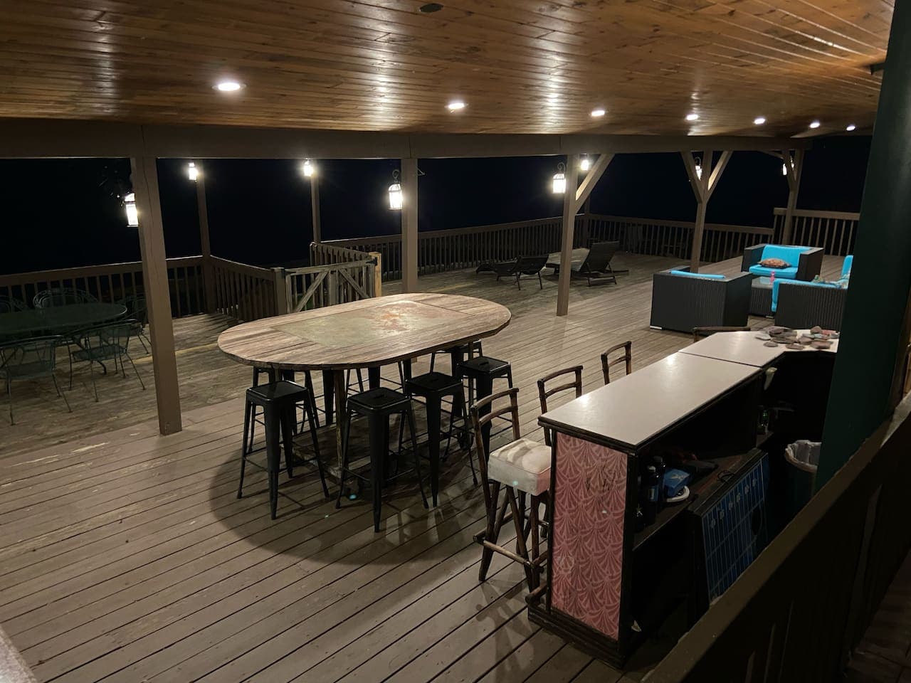 Outdoor dining area under string lights