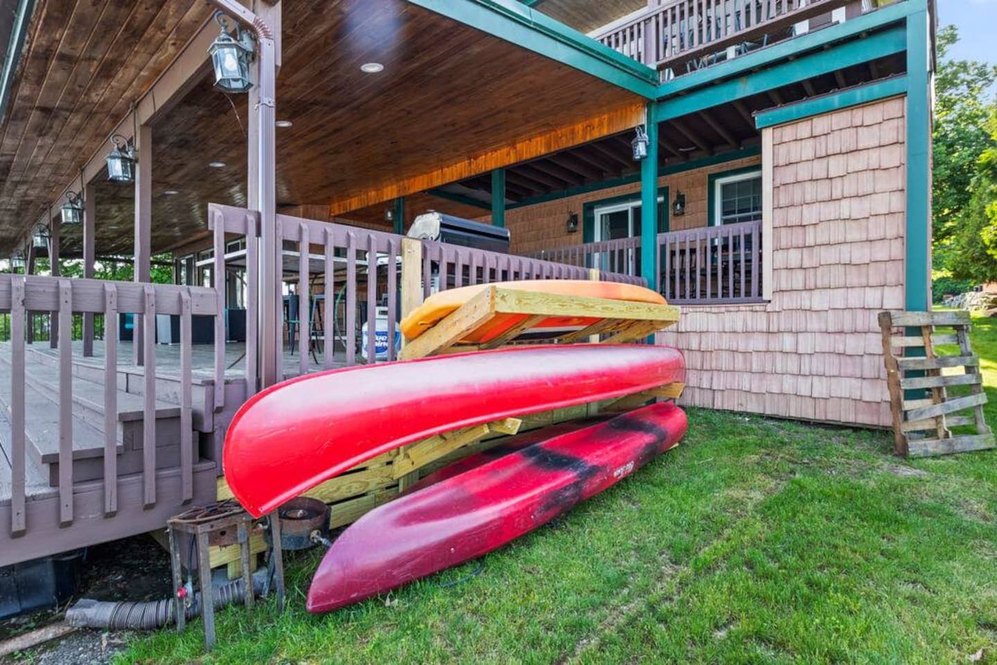 Kayaks stored beside the deck