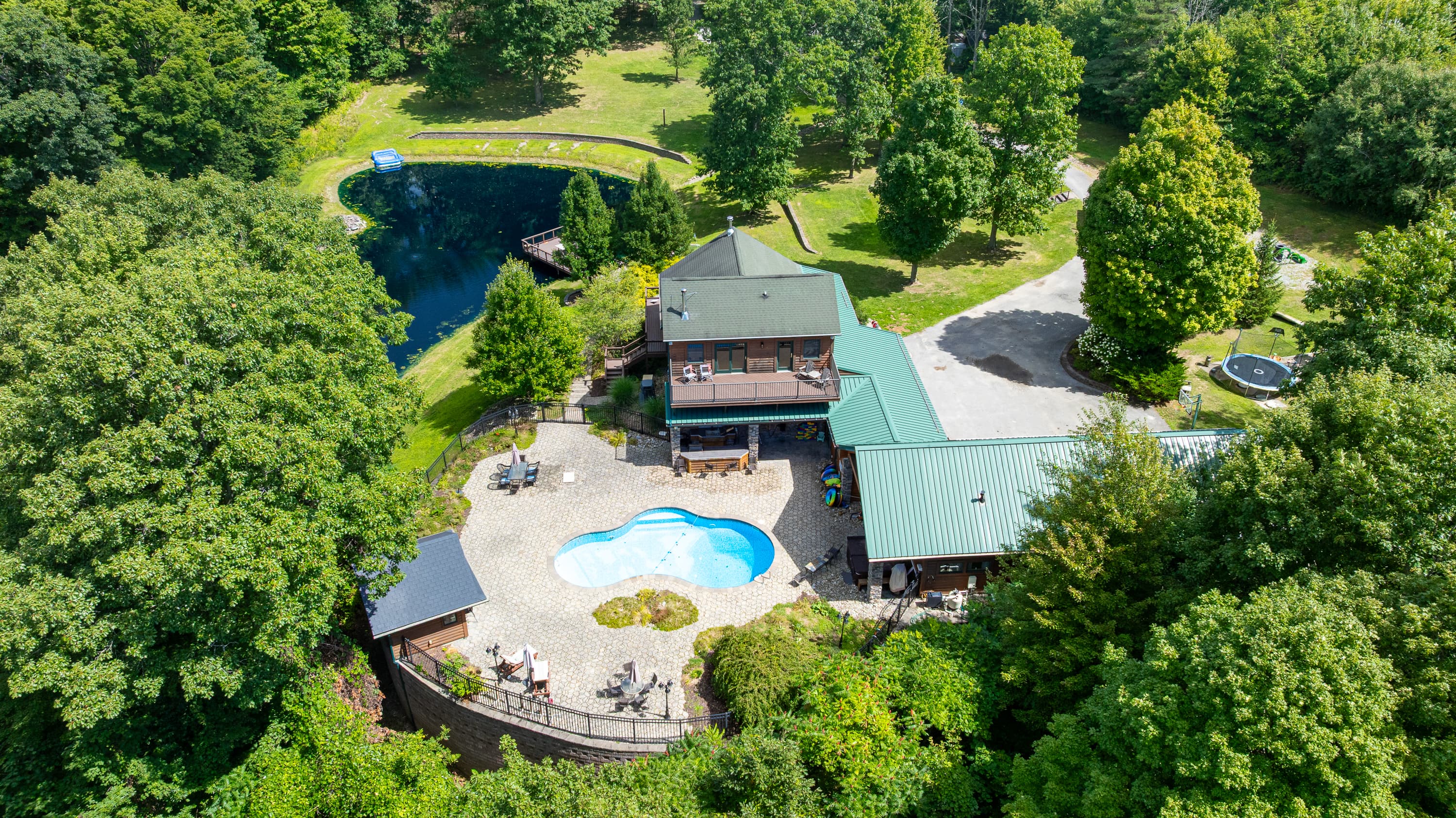 Aerial view of the home and pool