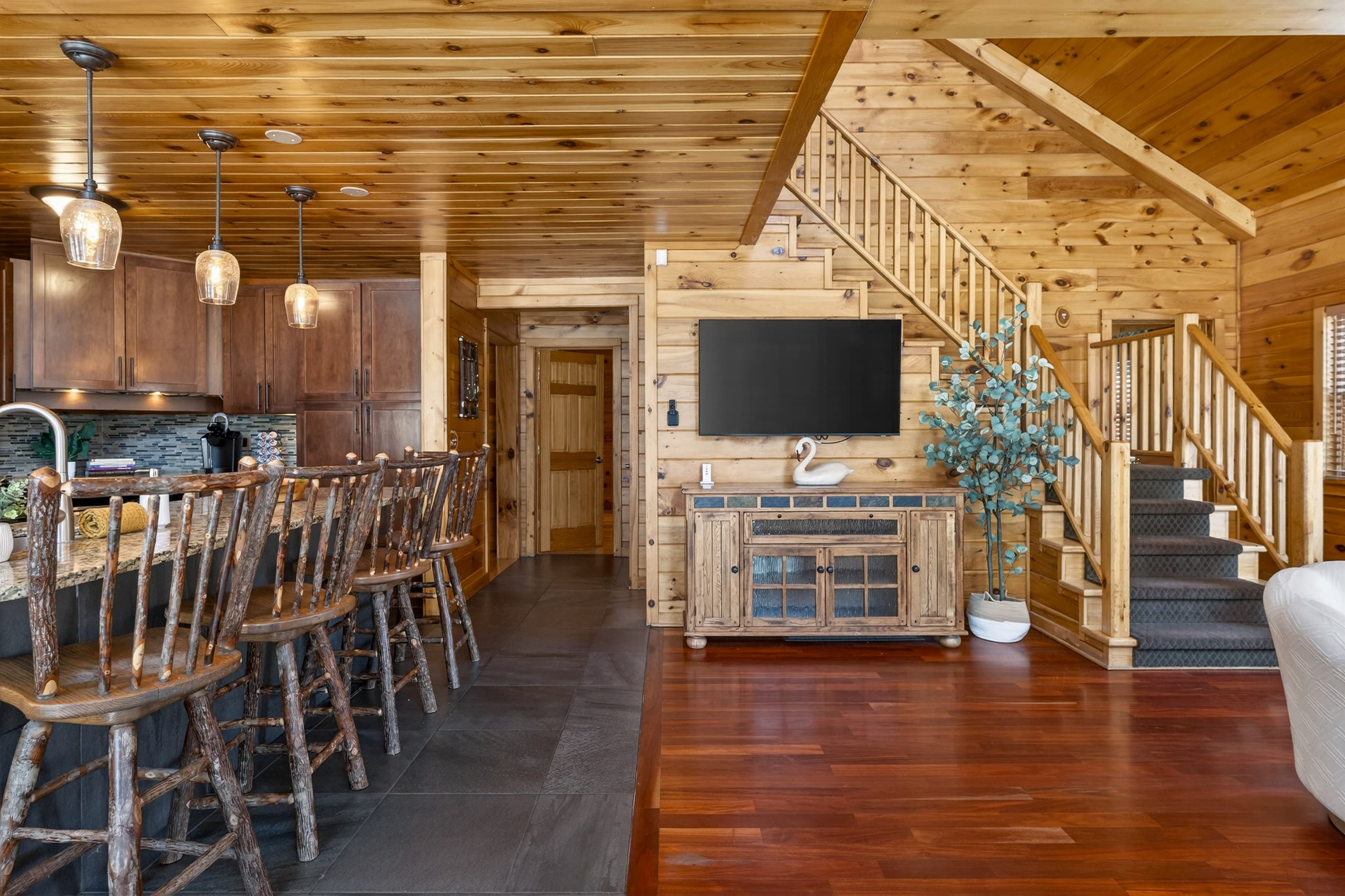 Wood-paneled entryway and staircase