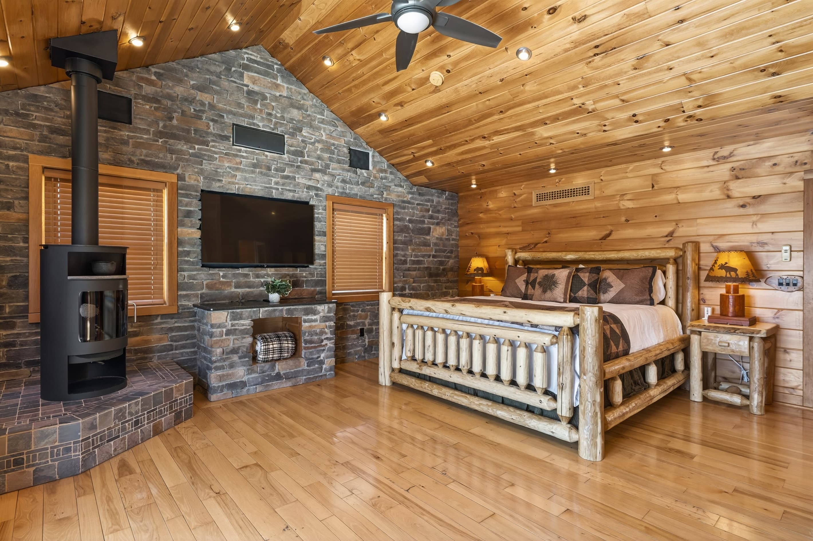 Stone fireplace with television