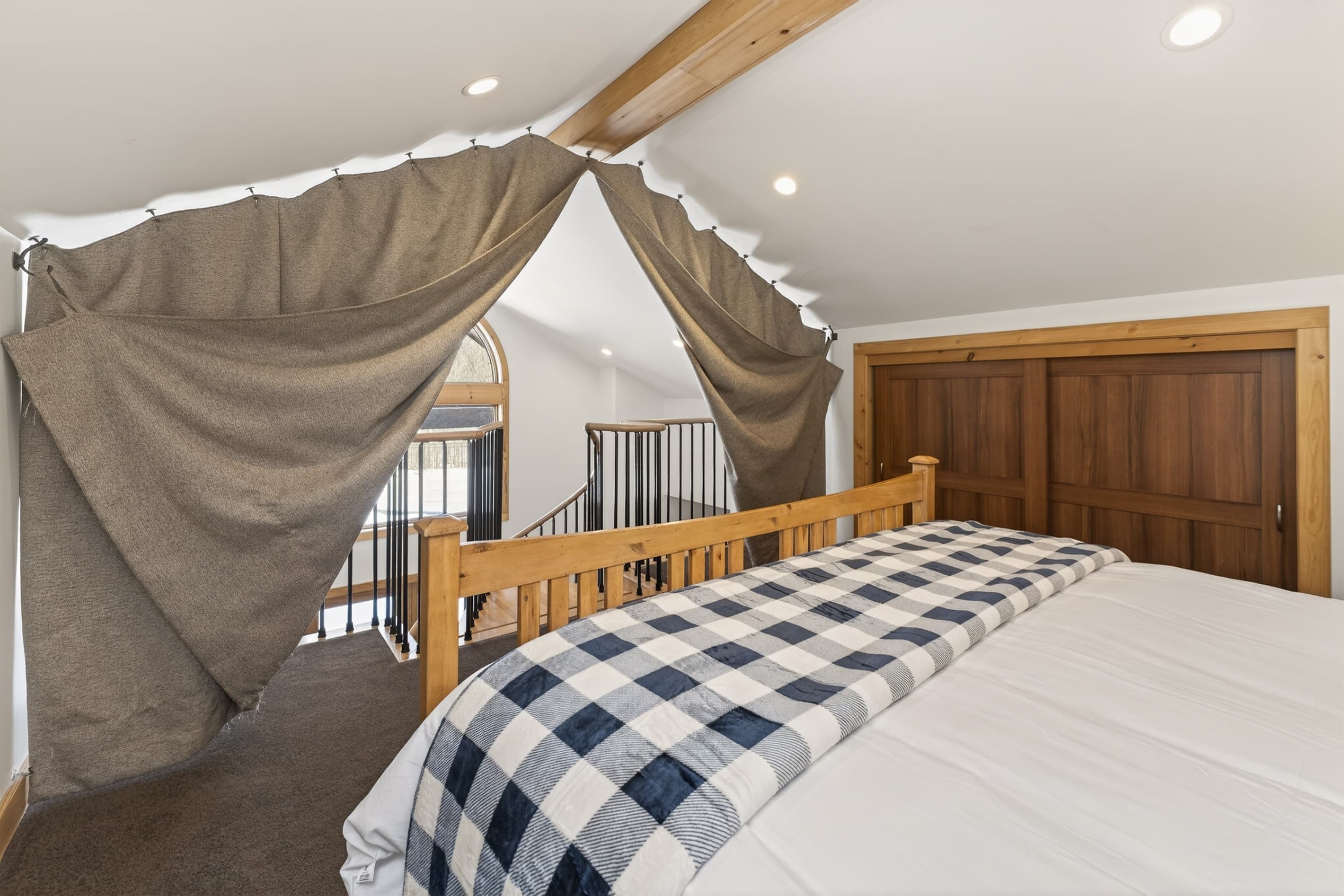 Bedroom with privacy curtains