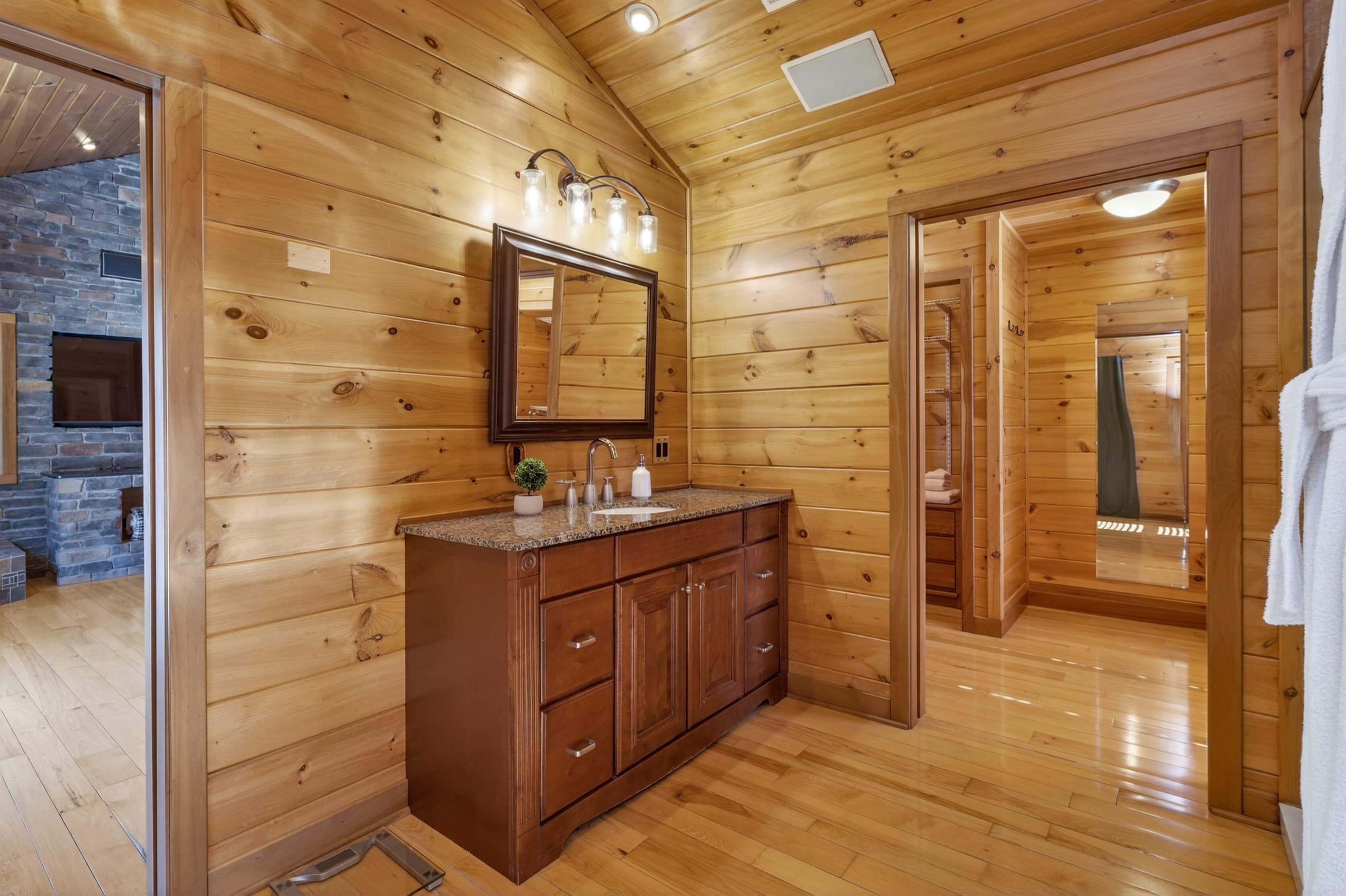 Wood-paneled hallway with dresser