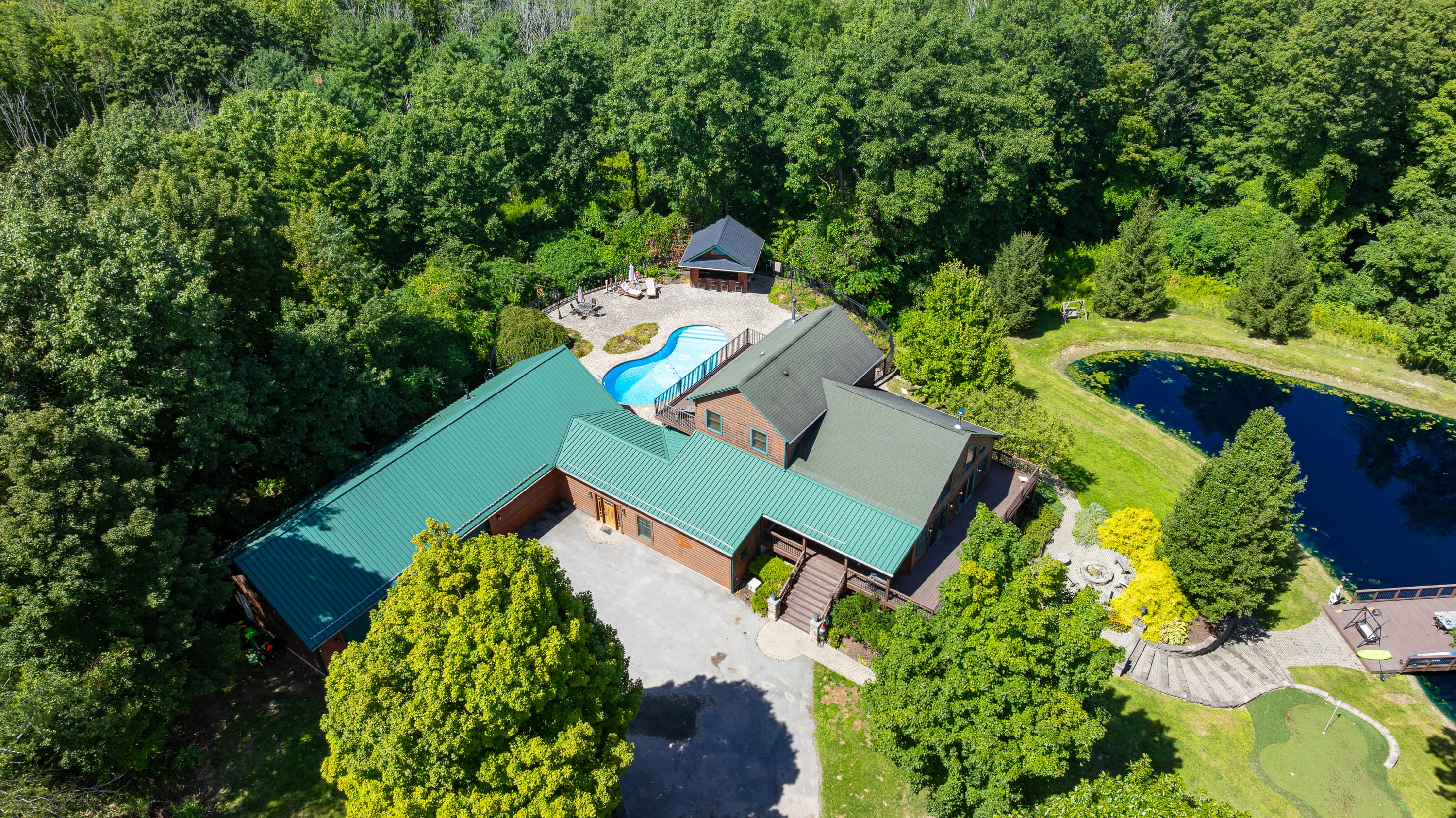 Aerial view of the house and pond