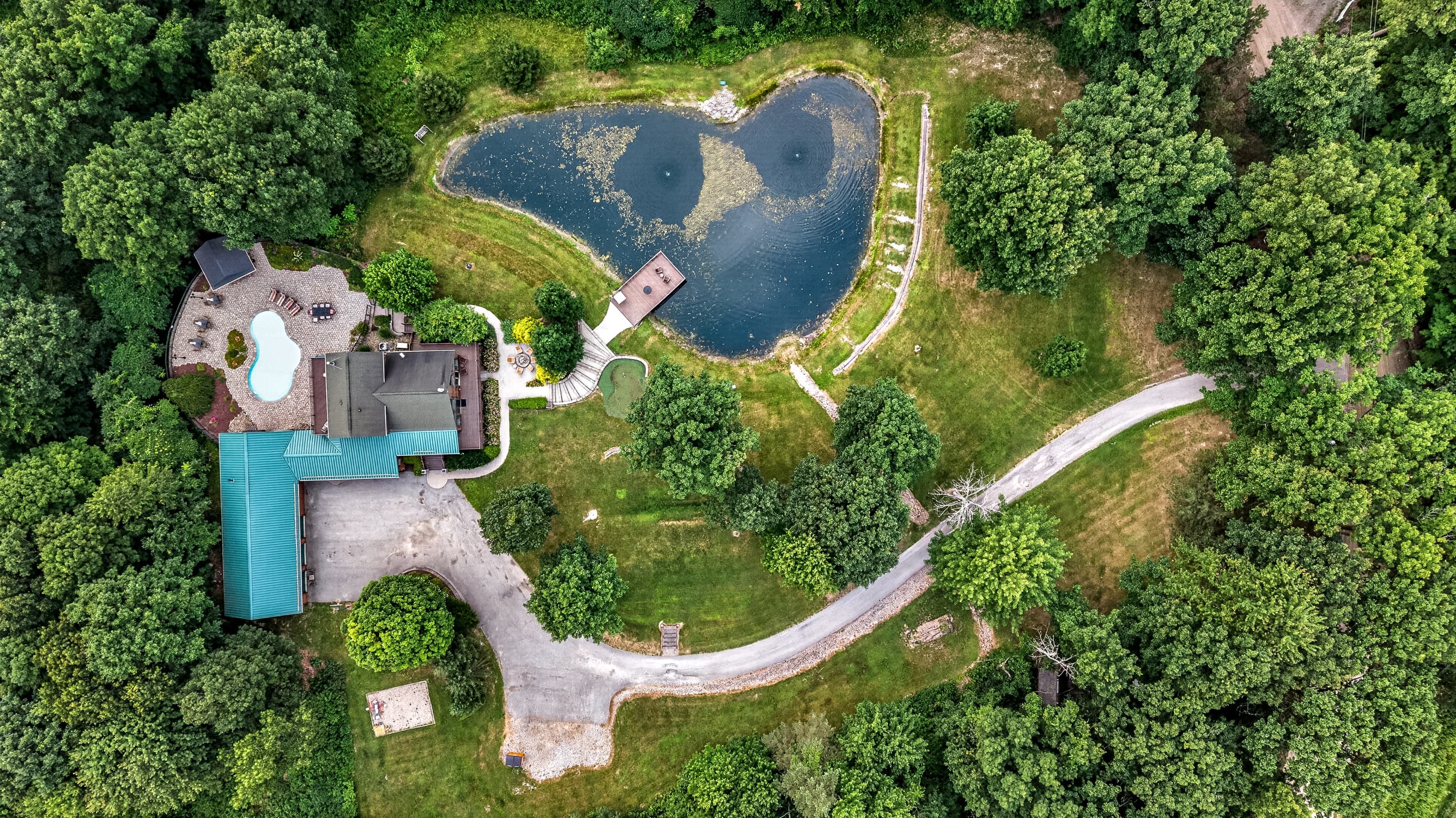 Aerial view of the pond and house