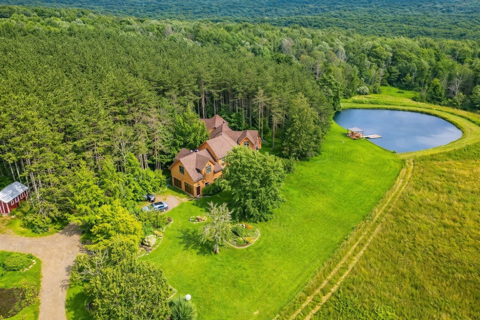Aerial view of the house and pond