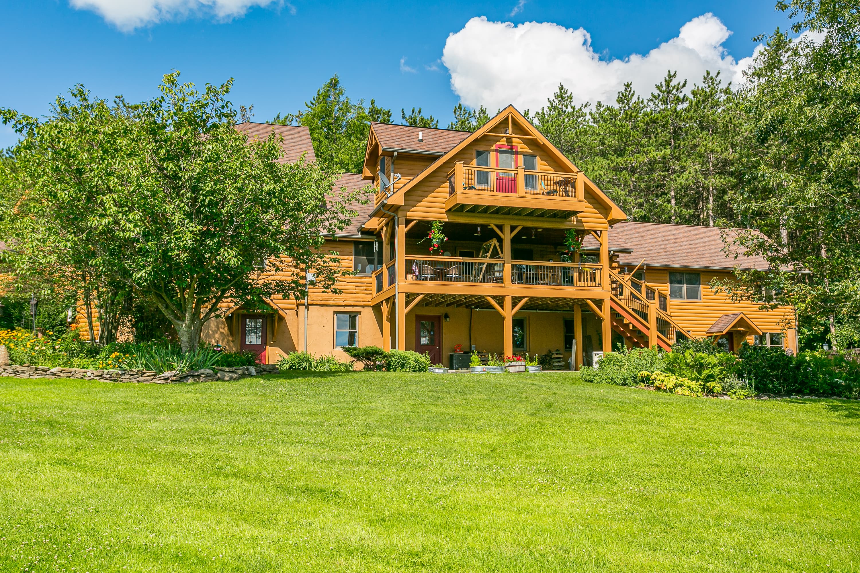Rear exterior with multiple wooden decks
