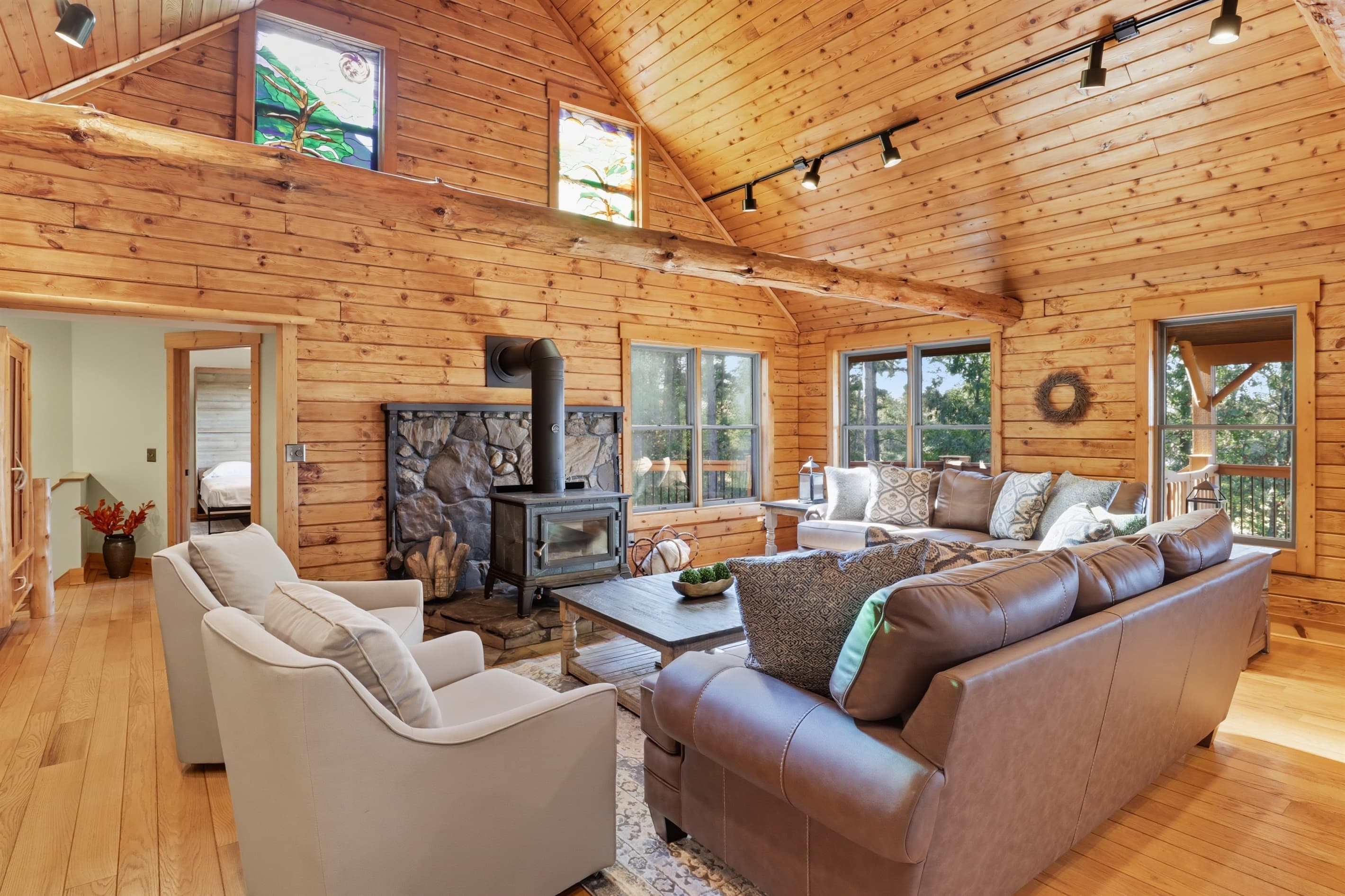 Living room with vaulted wood ceiling