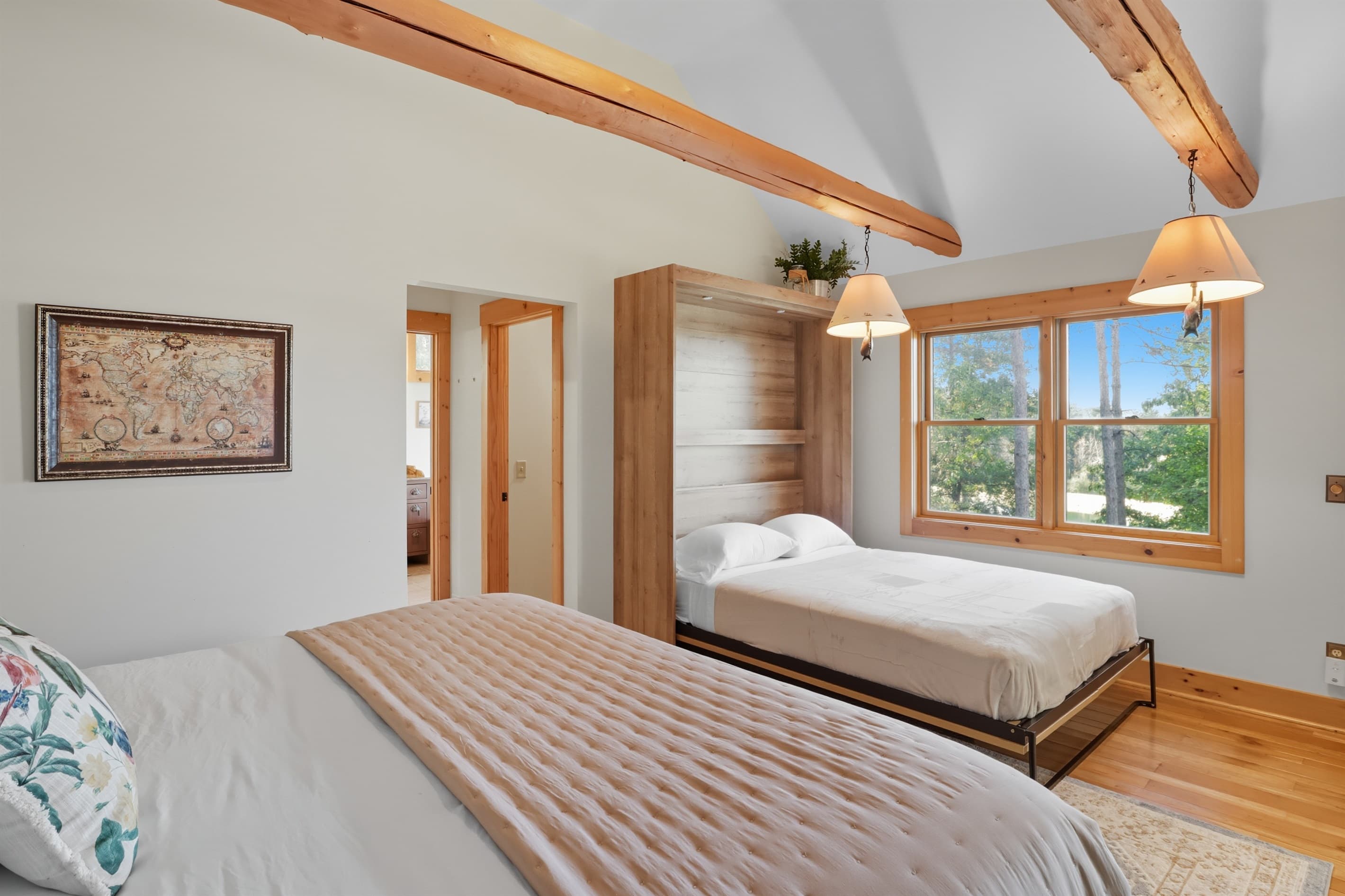 Primary suite with windows and an extra queen bed