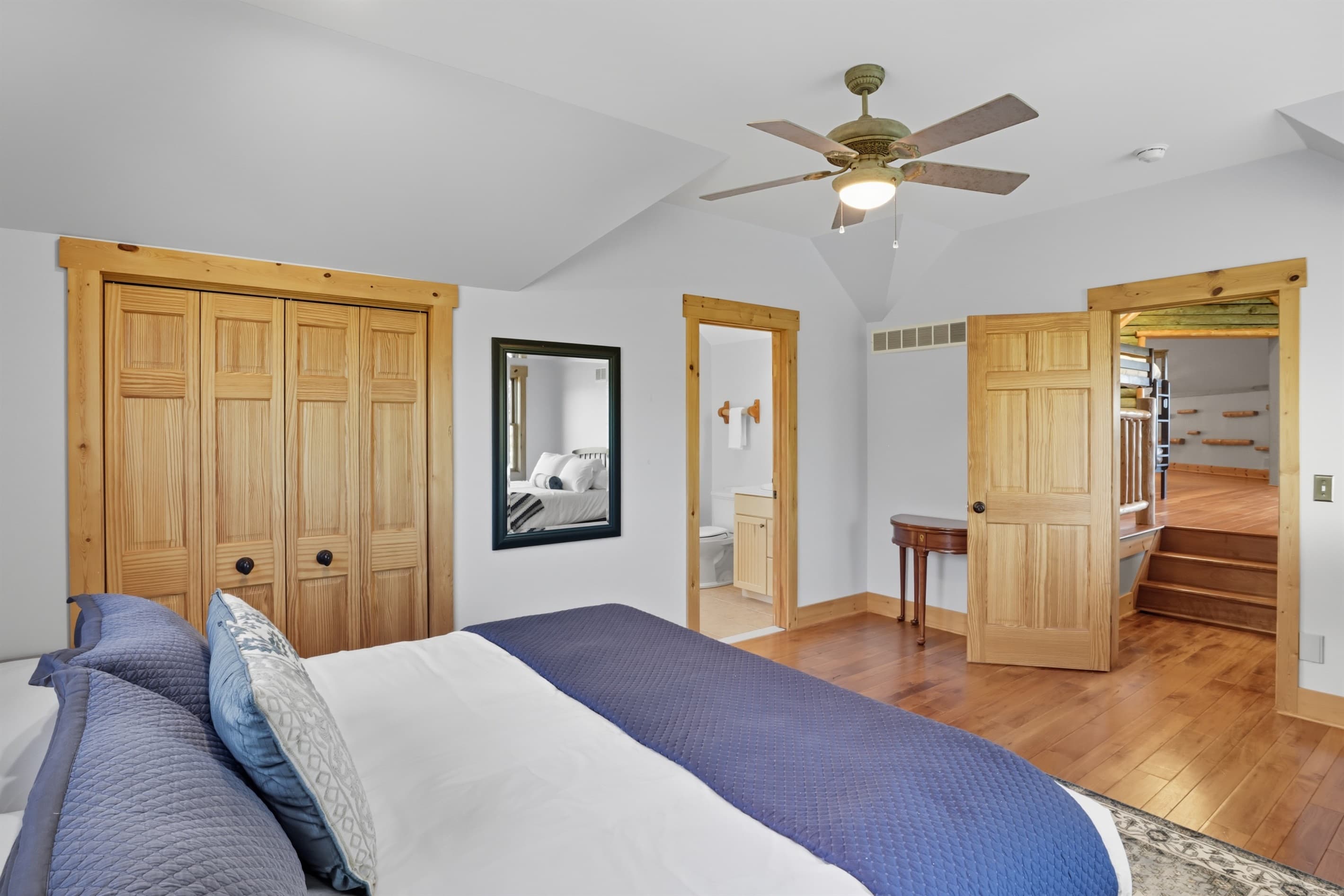 Bedroom with double-door wooden closets and ensuite bathroom
