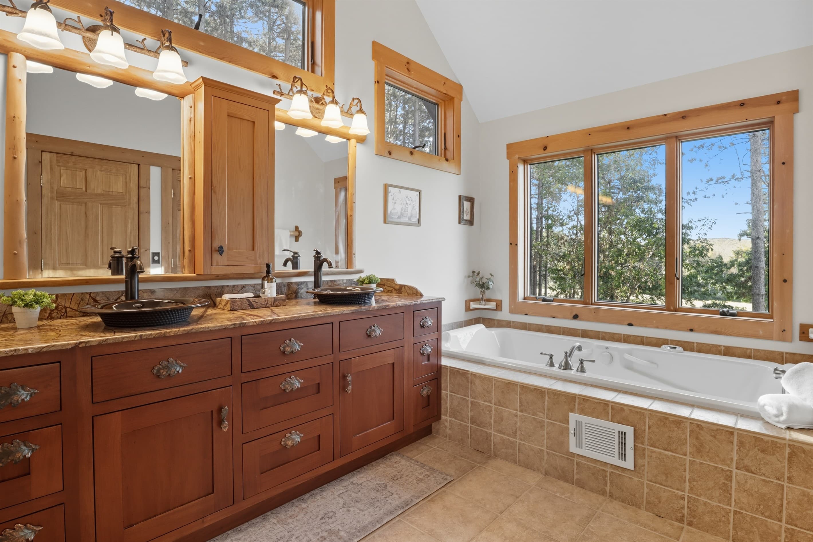 Primary bathroom with vanity and jet tub