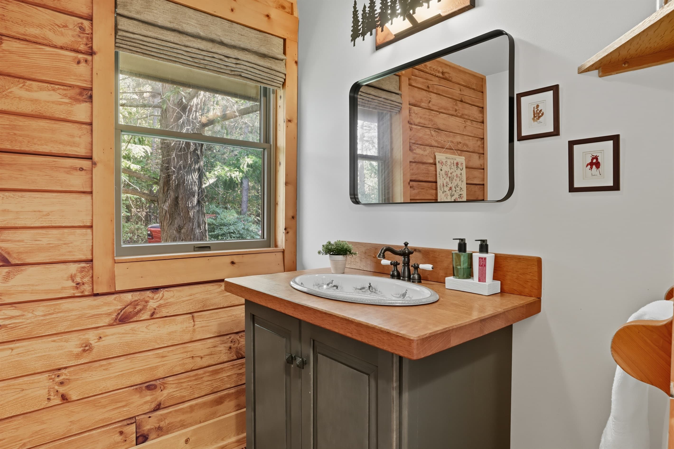 Bathroom vanity beside a large window