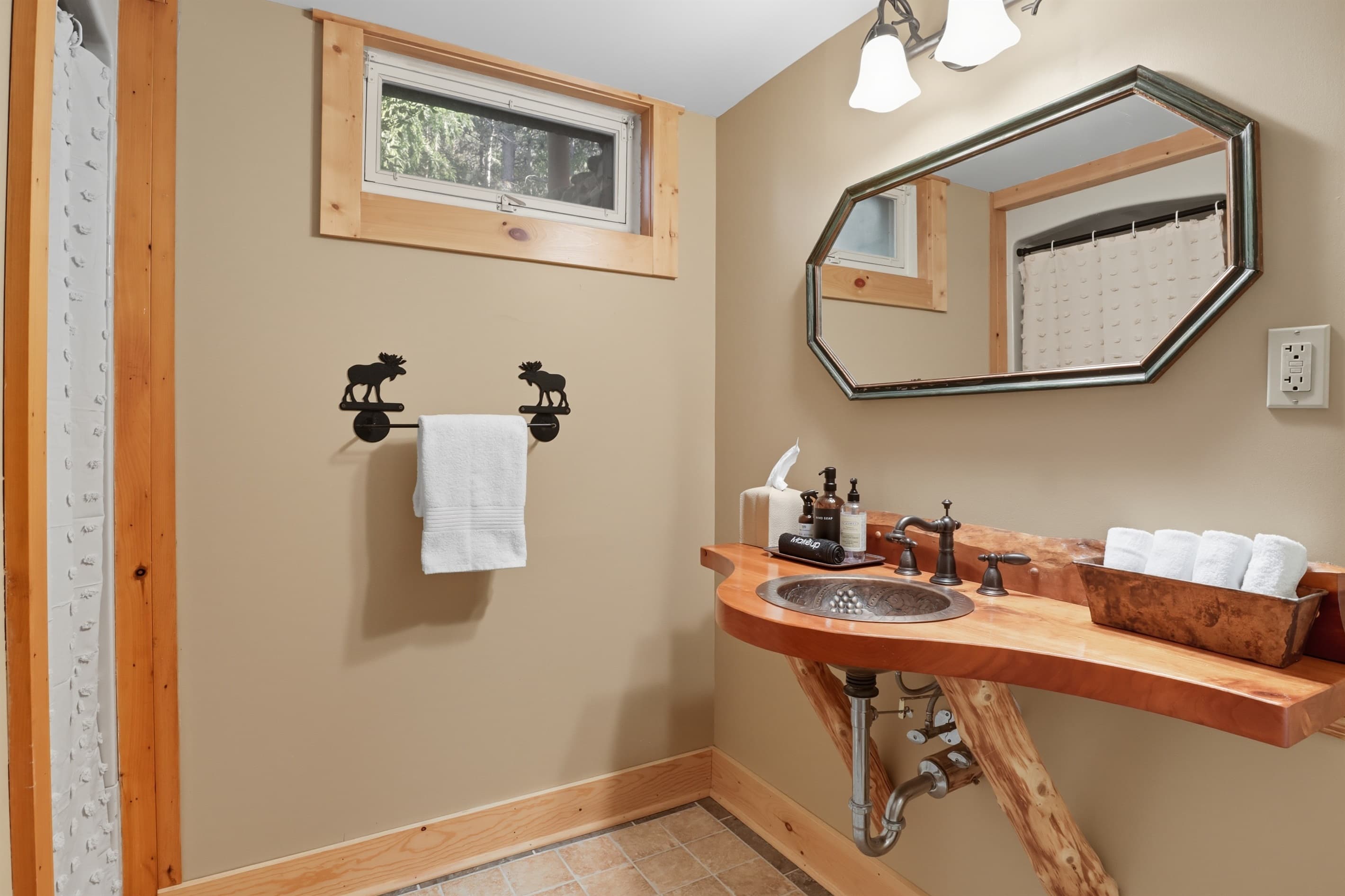 Basement bathroom with wooden vanity