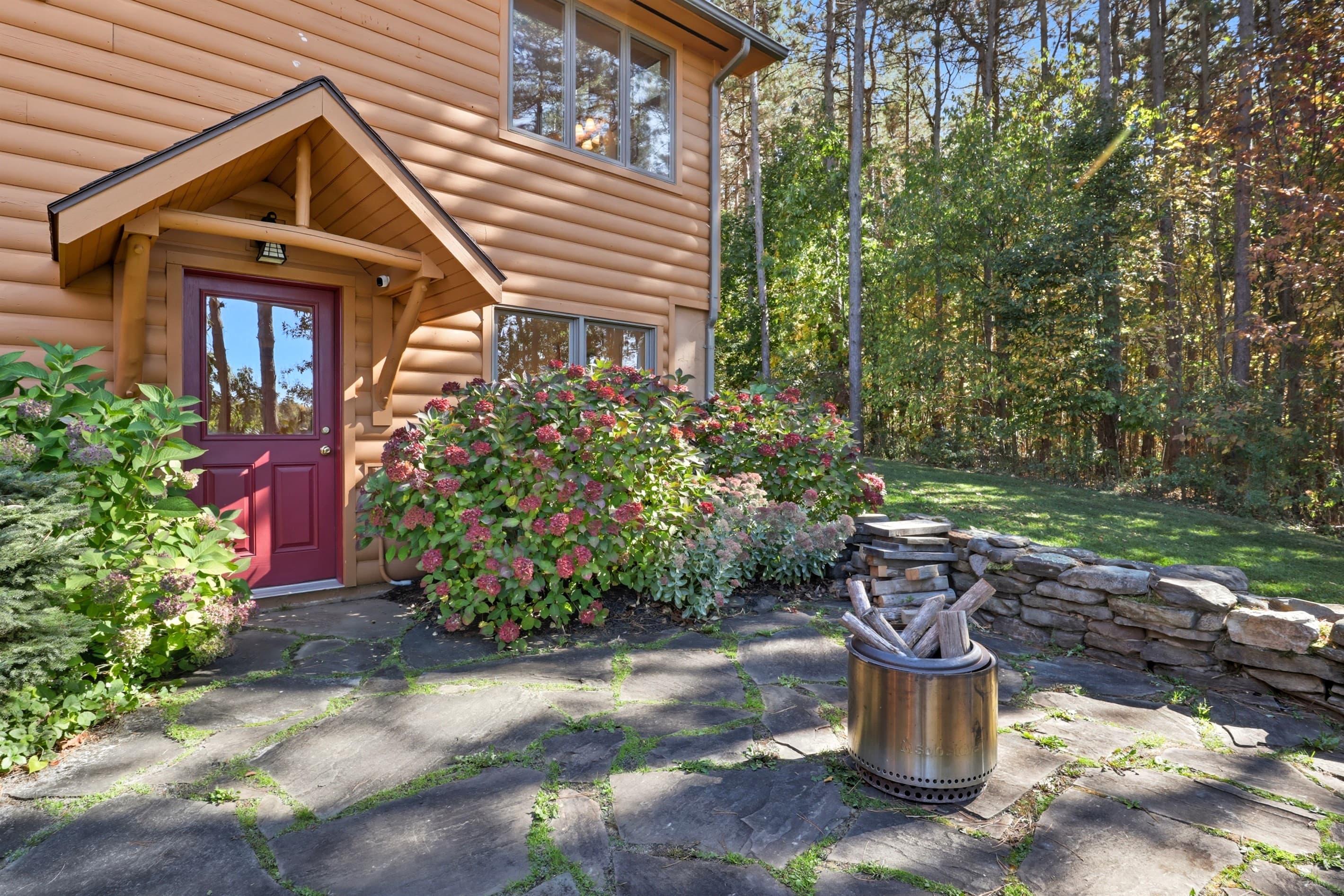 Wood exterior with red entry door