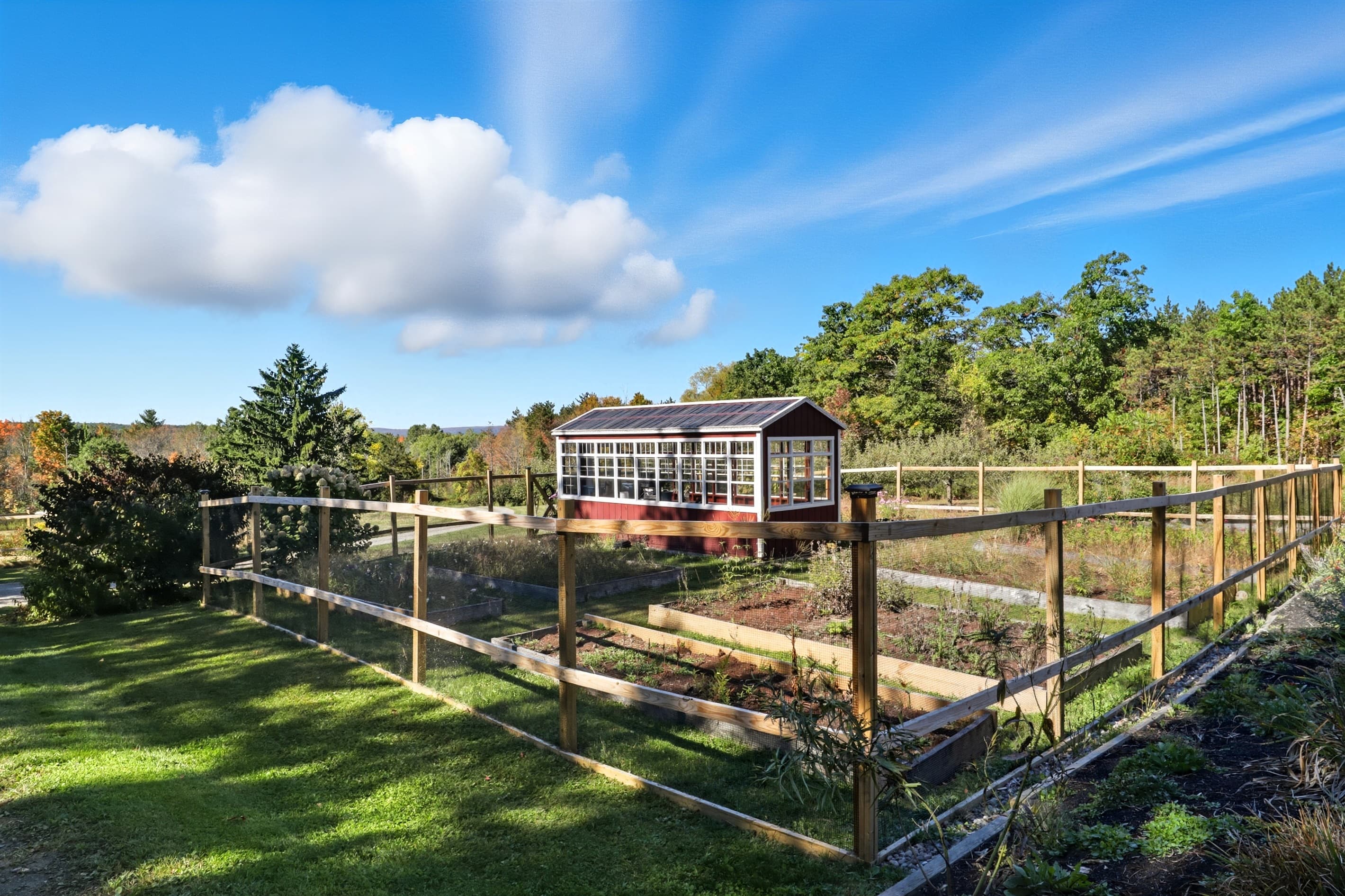 Fenced garden with raised planting beds