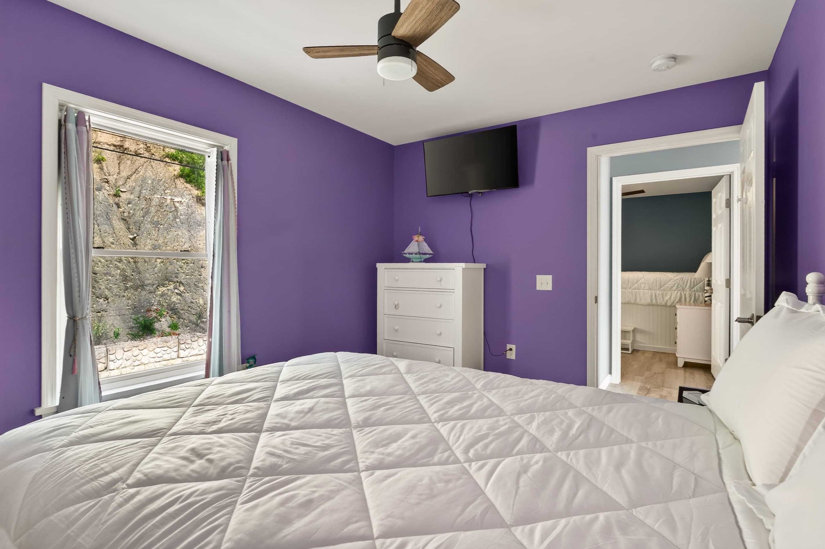 Bedroom window overlooking the rocky hillside