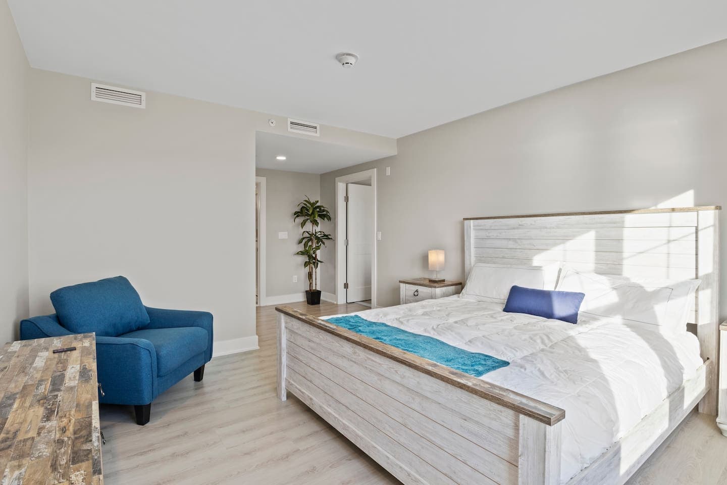 Bedroom with blue accent chair