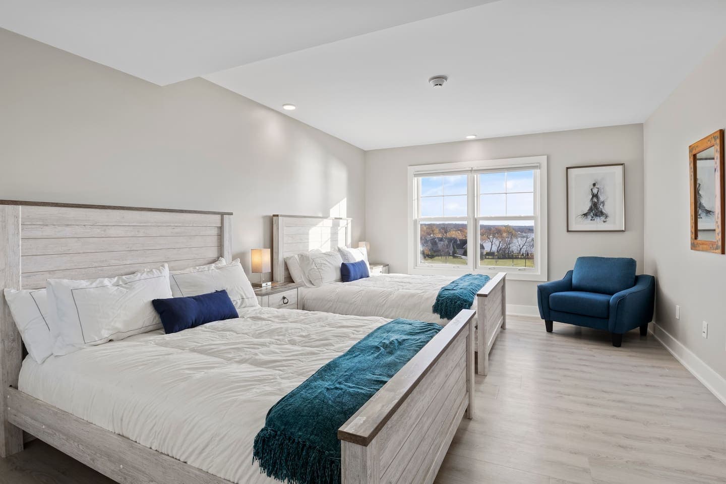 Bedroom with two beds and blue accents