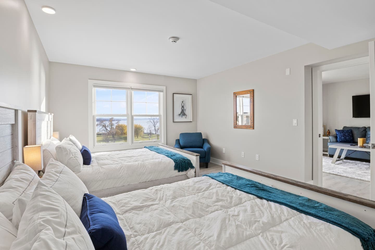 Bright bedroom with armchair and window