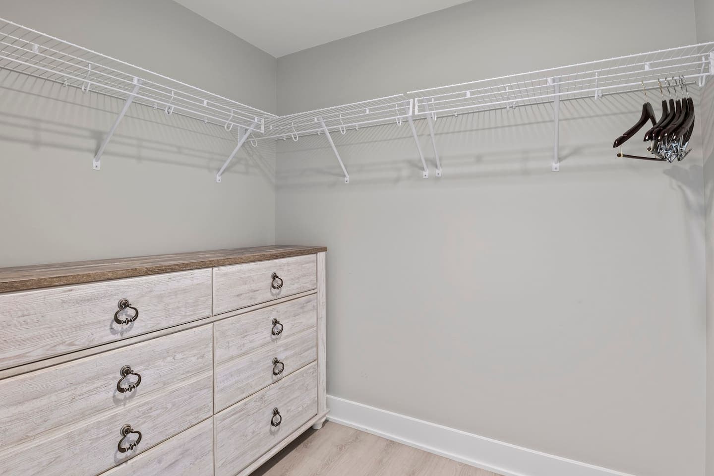 Walk in closet with dresser and hanging area