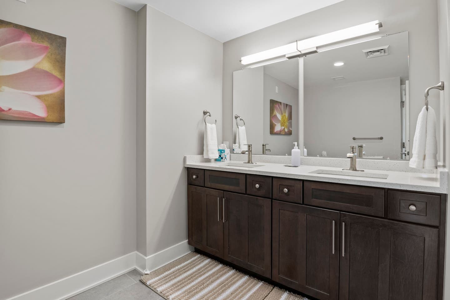 Bathroom with double vanity and large mirror