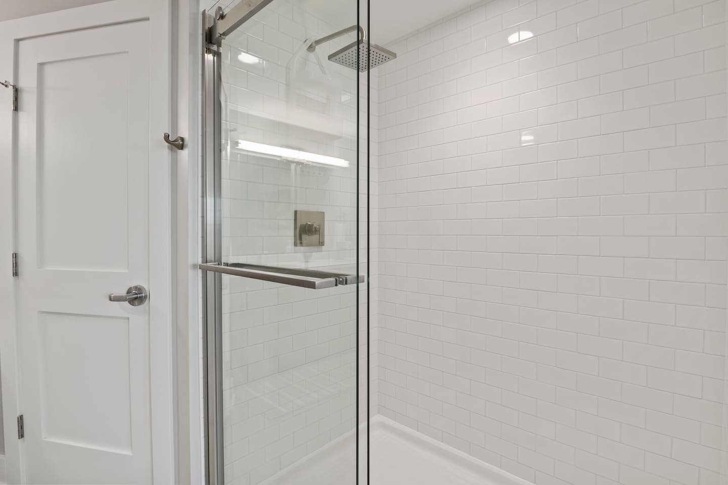 Glass-enclosed walk-in shower