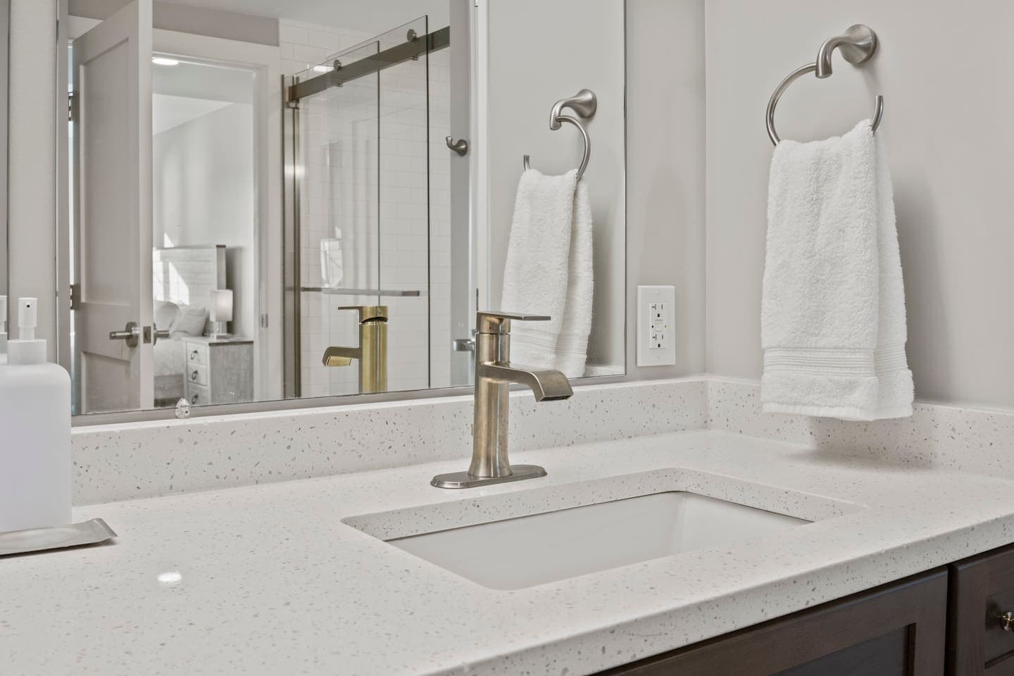 Bathroom sink beside the shower enclosure