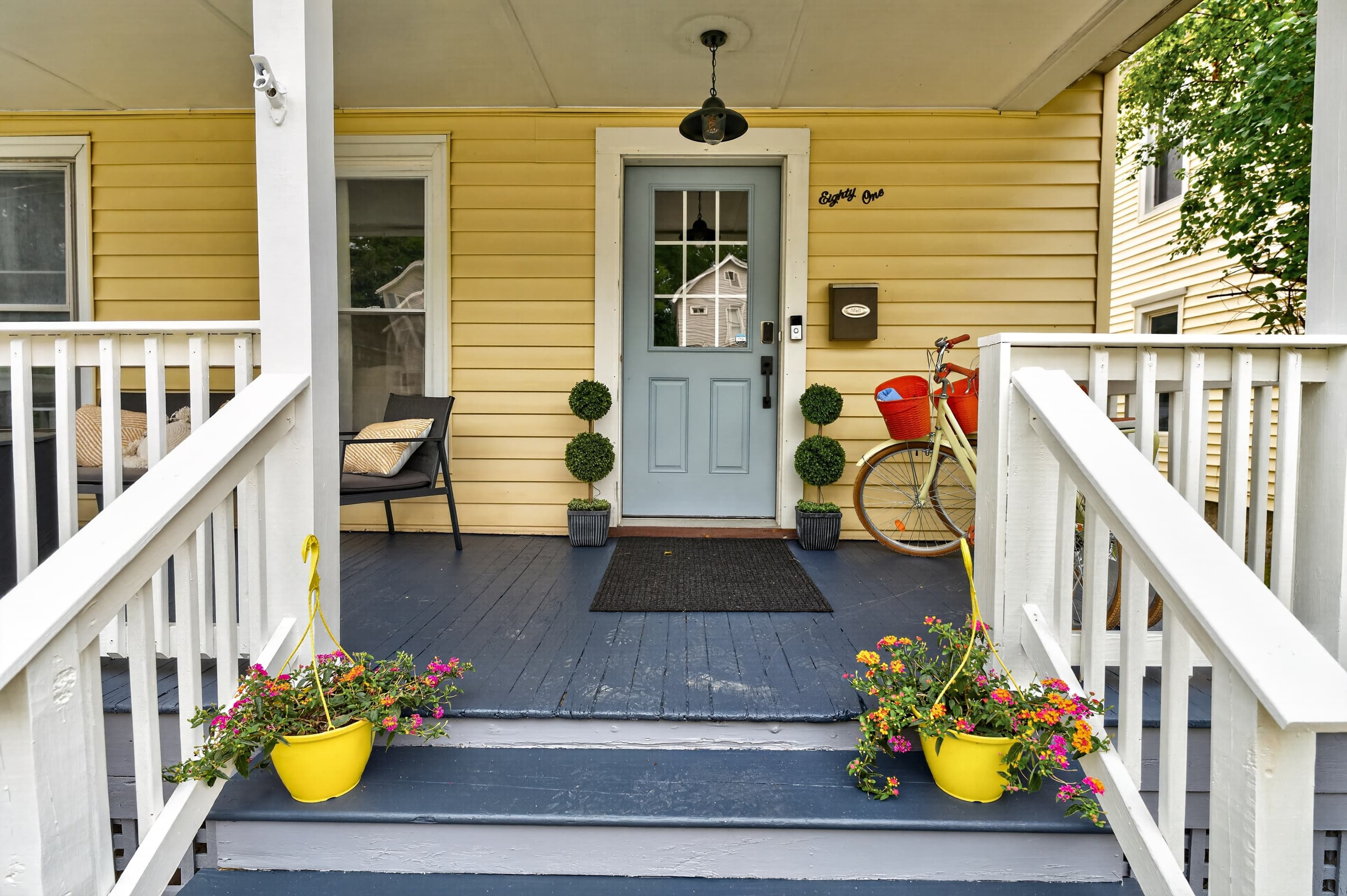 Front entrance with steps and flower planters