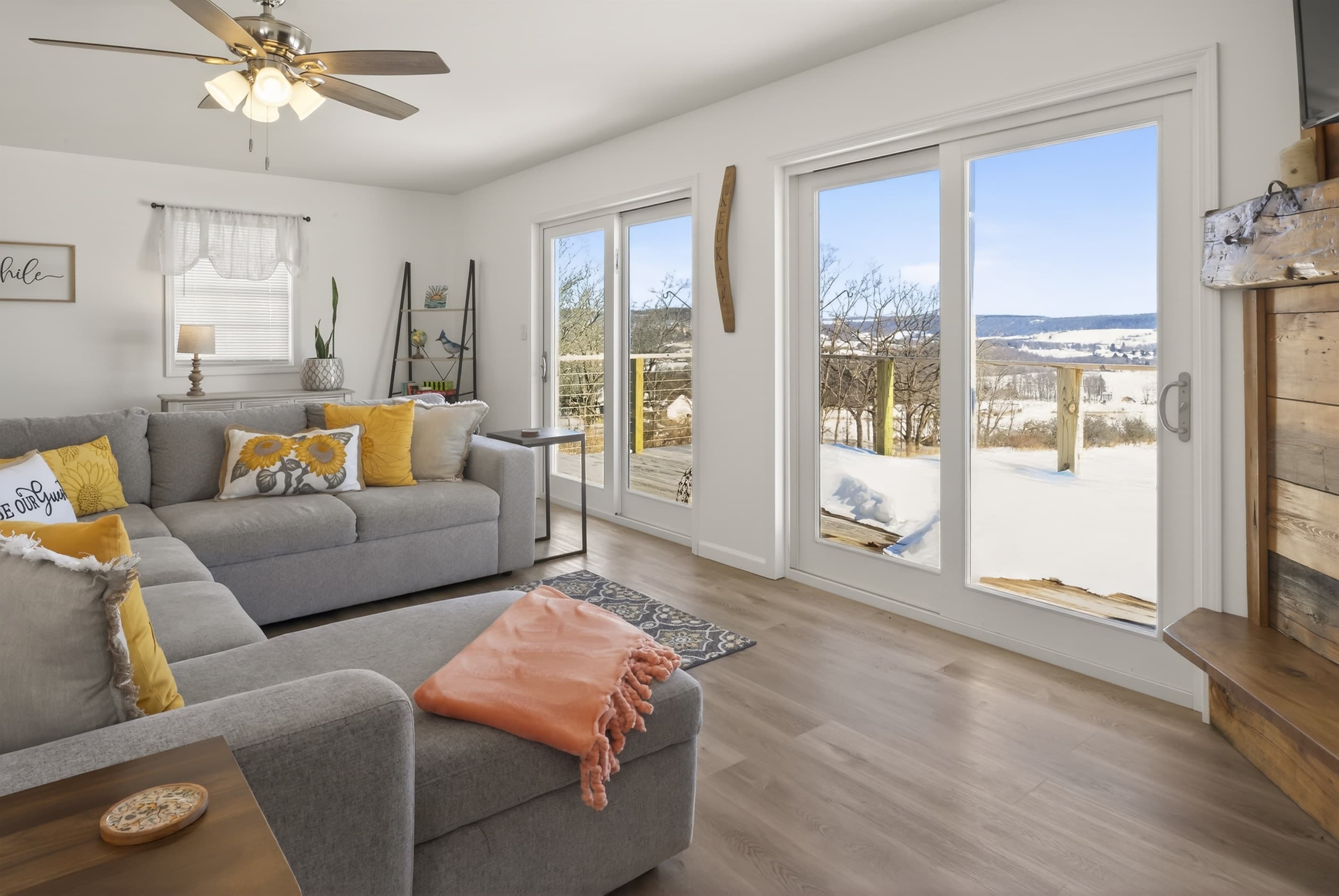 Bright living room with sectional and glass doors