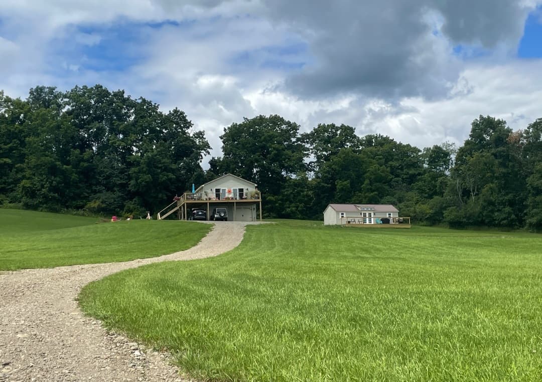 Curved gravel driveway leading to the house